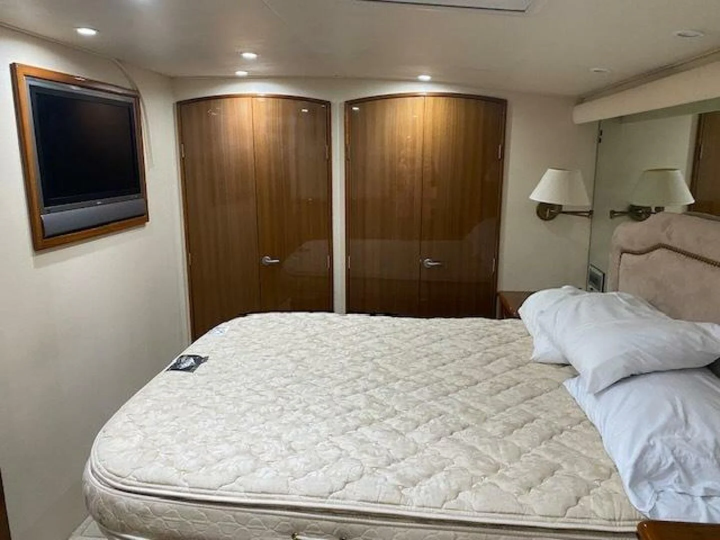 a hotel room with a bed and television aboard STABILIZED Yacht for Sale