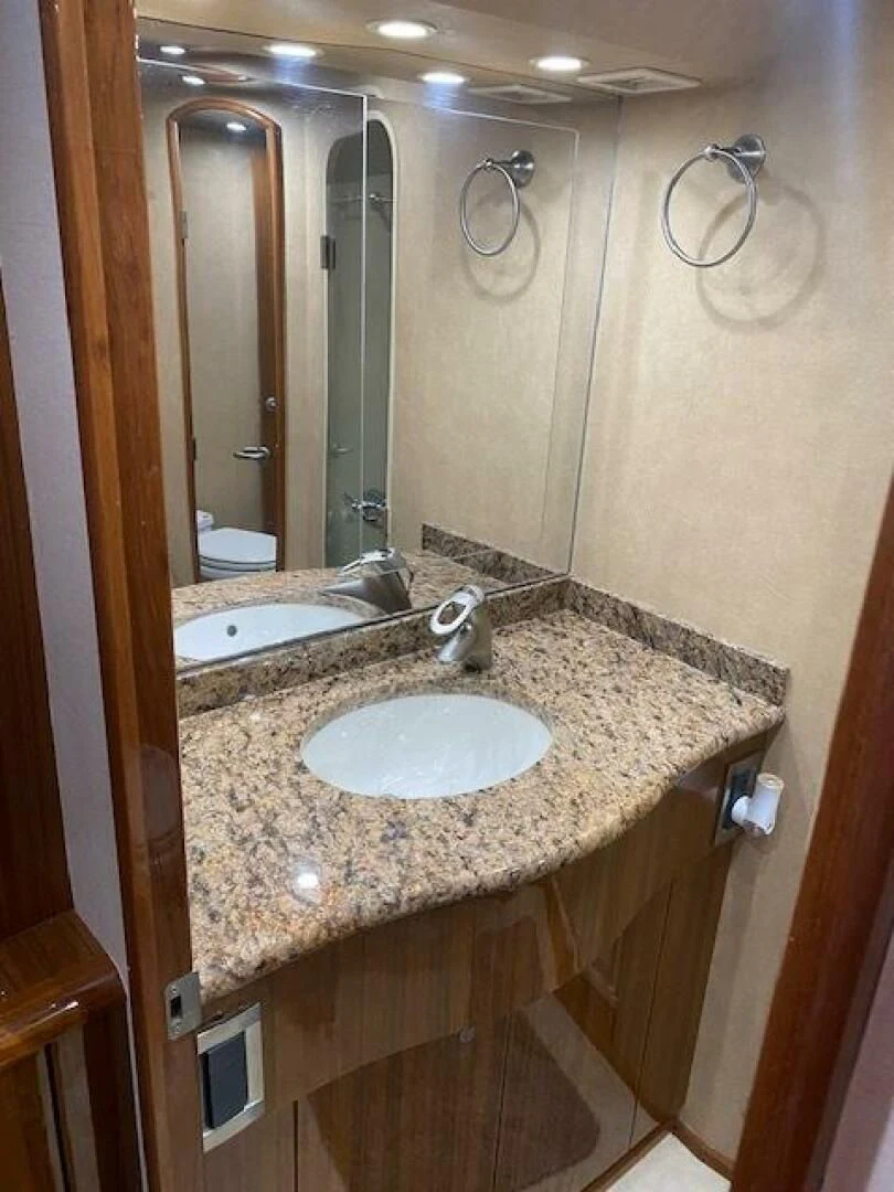 a bathroom with a large mirror aboard STABILIZED Yacht for Sale