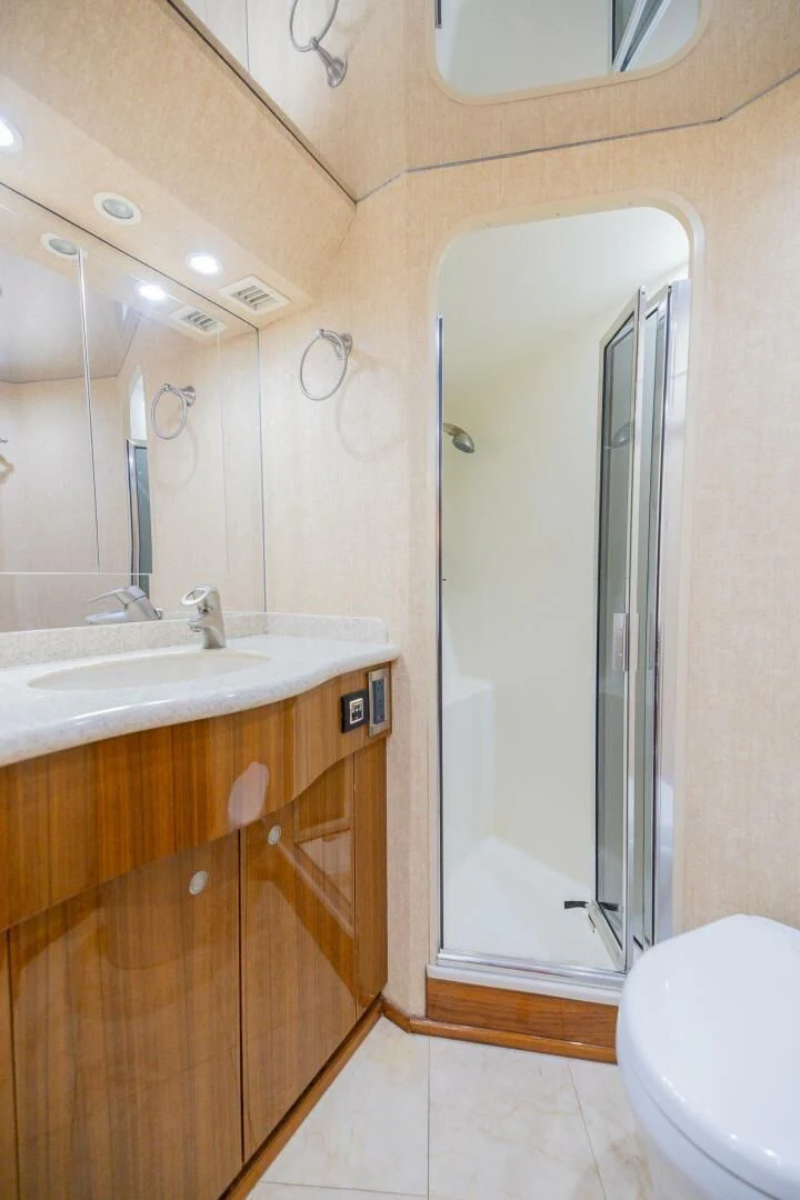 a bathroom with a large mirror aboard STABILIZED Yacht for Sale