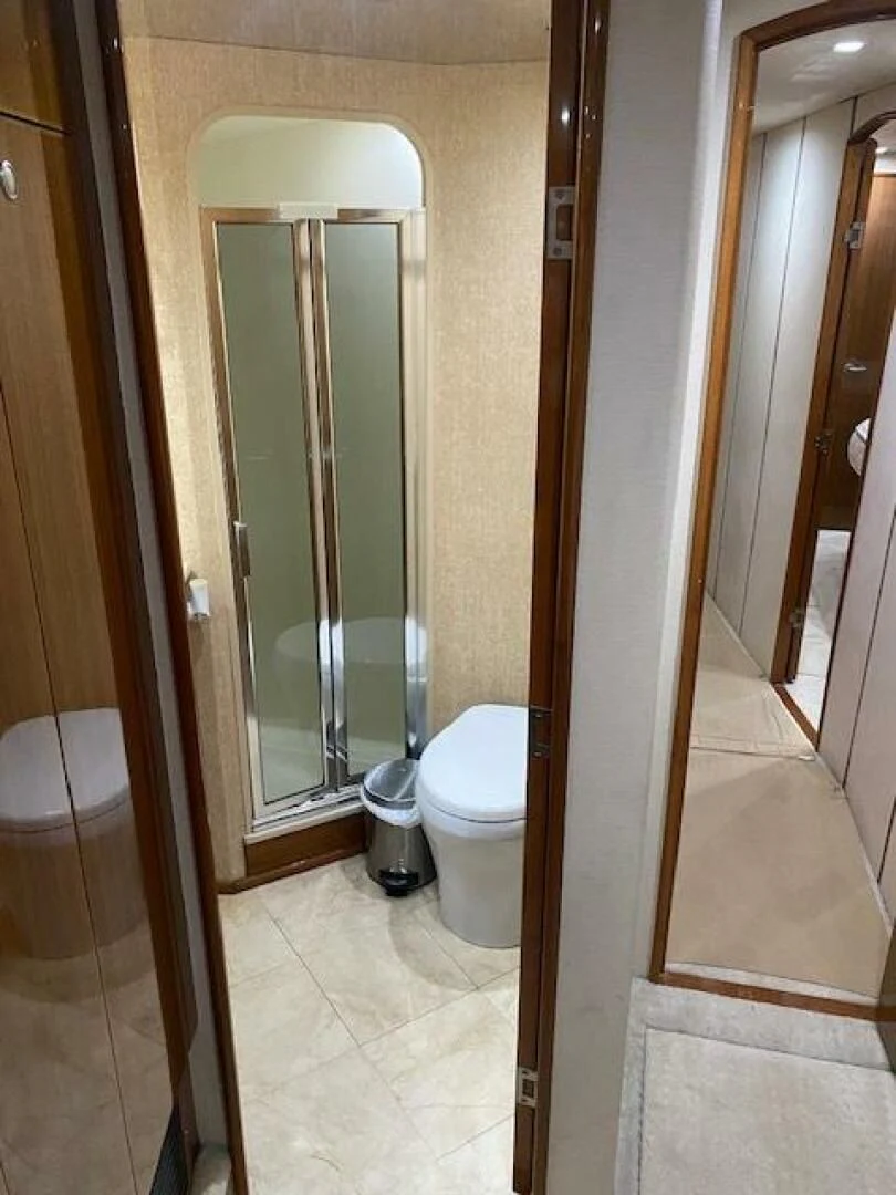 a bathroom with a glass shower aboard STABILIZED Yacht for Sale