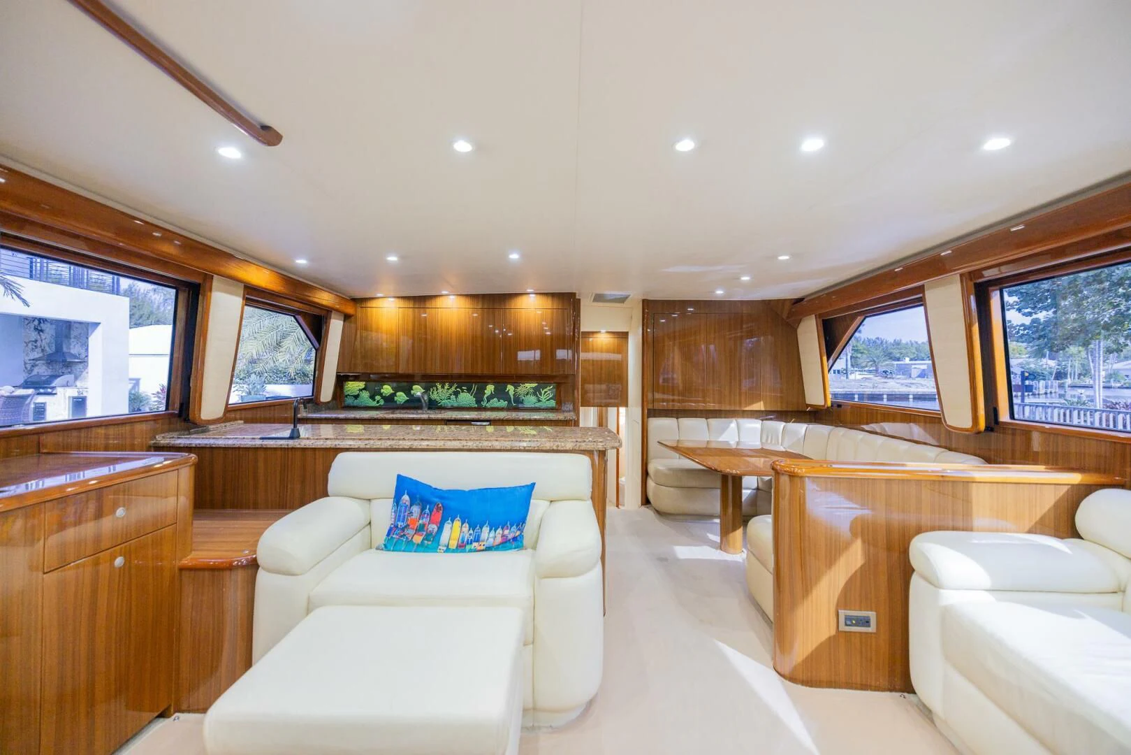 a large room with a couch and a table aboard STABILIZED Yacht for Sale