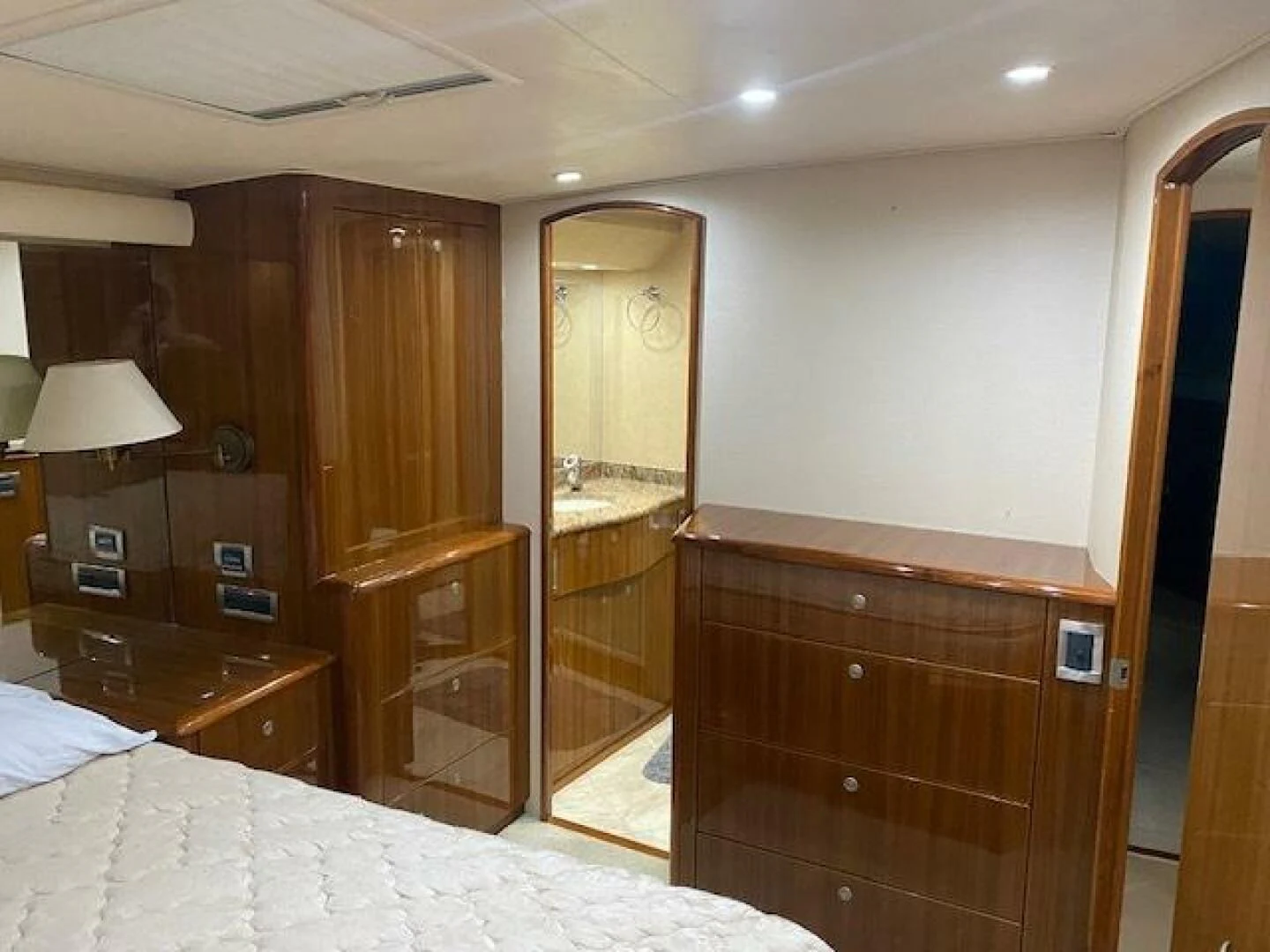 a bedroom with a bed and a mirror aboard STABILIZED Yacht for Sale