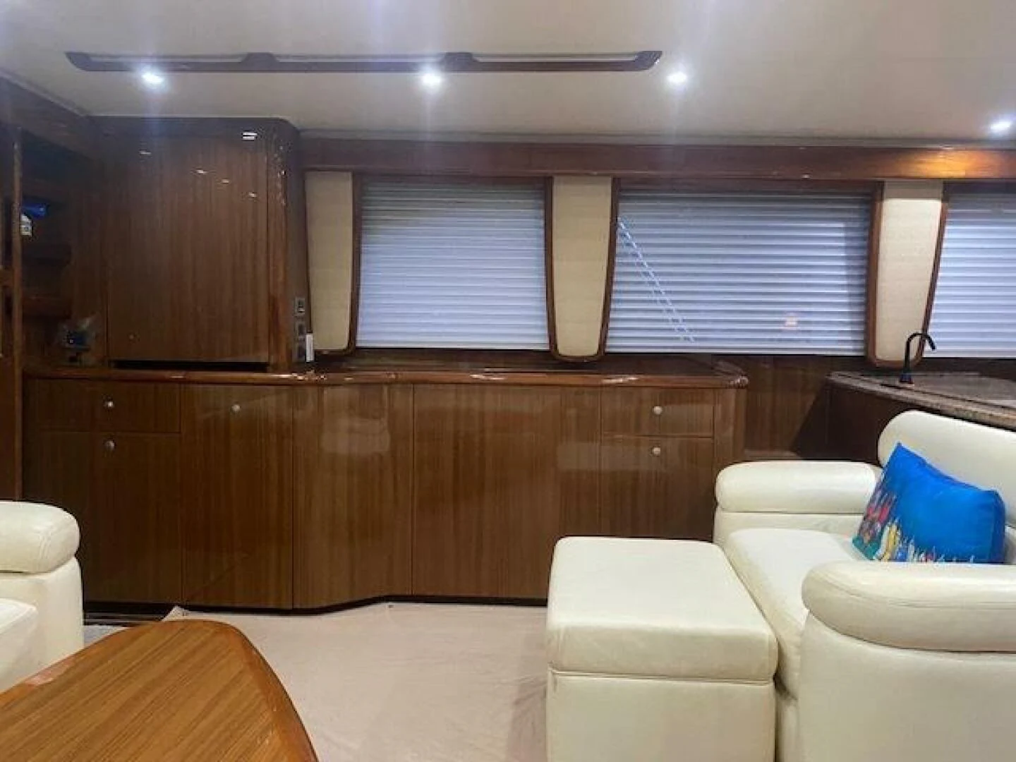 a room with a couch and a table and a window aboard STABILIZED Yacht for Sale