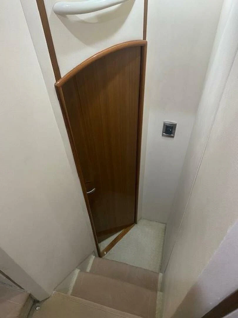 a wooden door in a room aboard STABILIZED Yacht for Sale