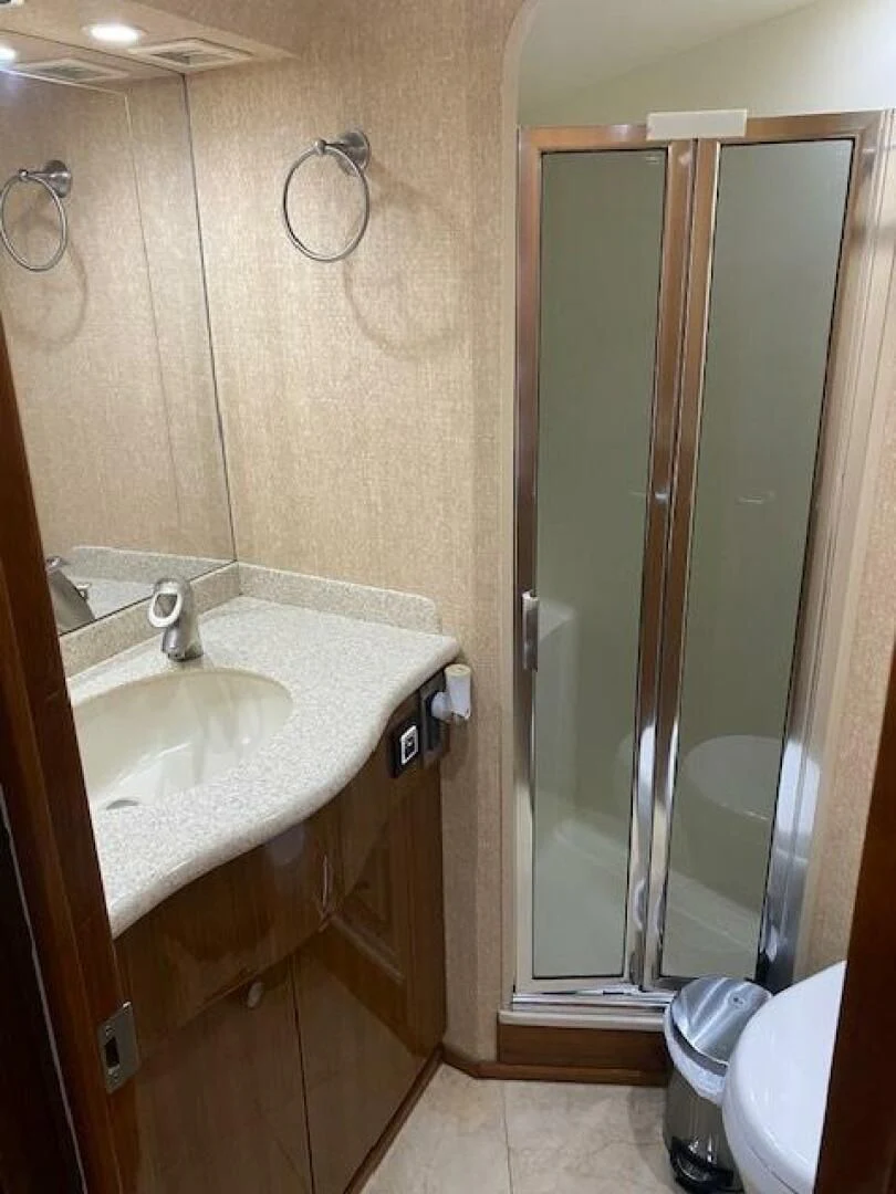 a bathroom with a sink and a shower aboard STABILIZED Yacht for Sale