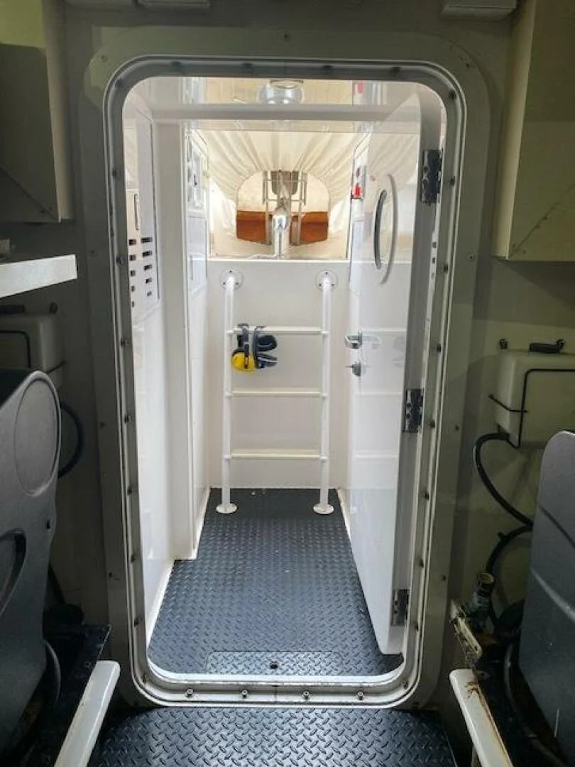 a door open with a door open aboard STABILIZED Yacht for Sale