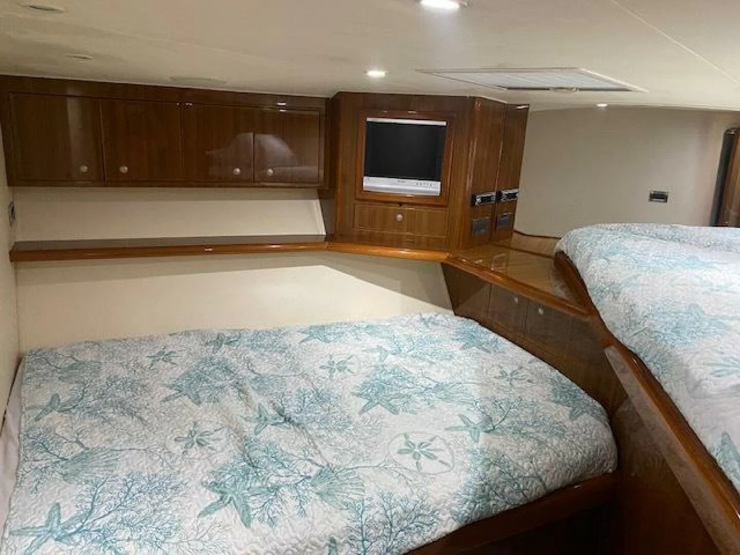 a room with a bed and a television aboard STABILIZED Yacht for Sale