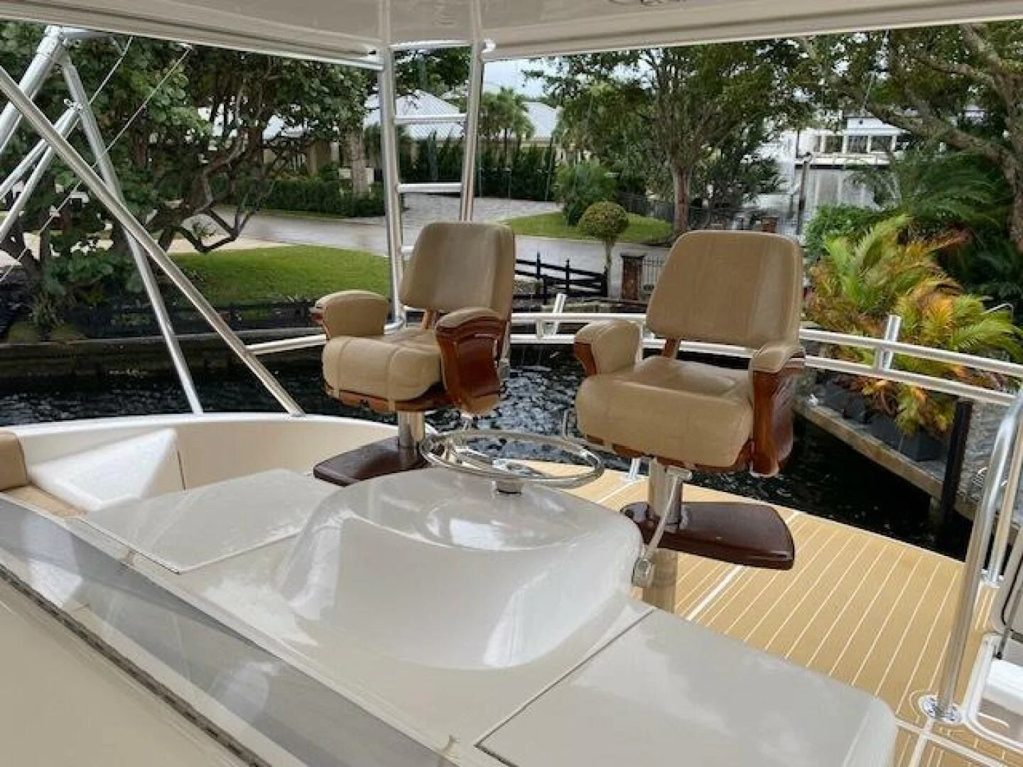 a table with chairs and a glass window aboard STABILIZED Yacht for Sale