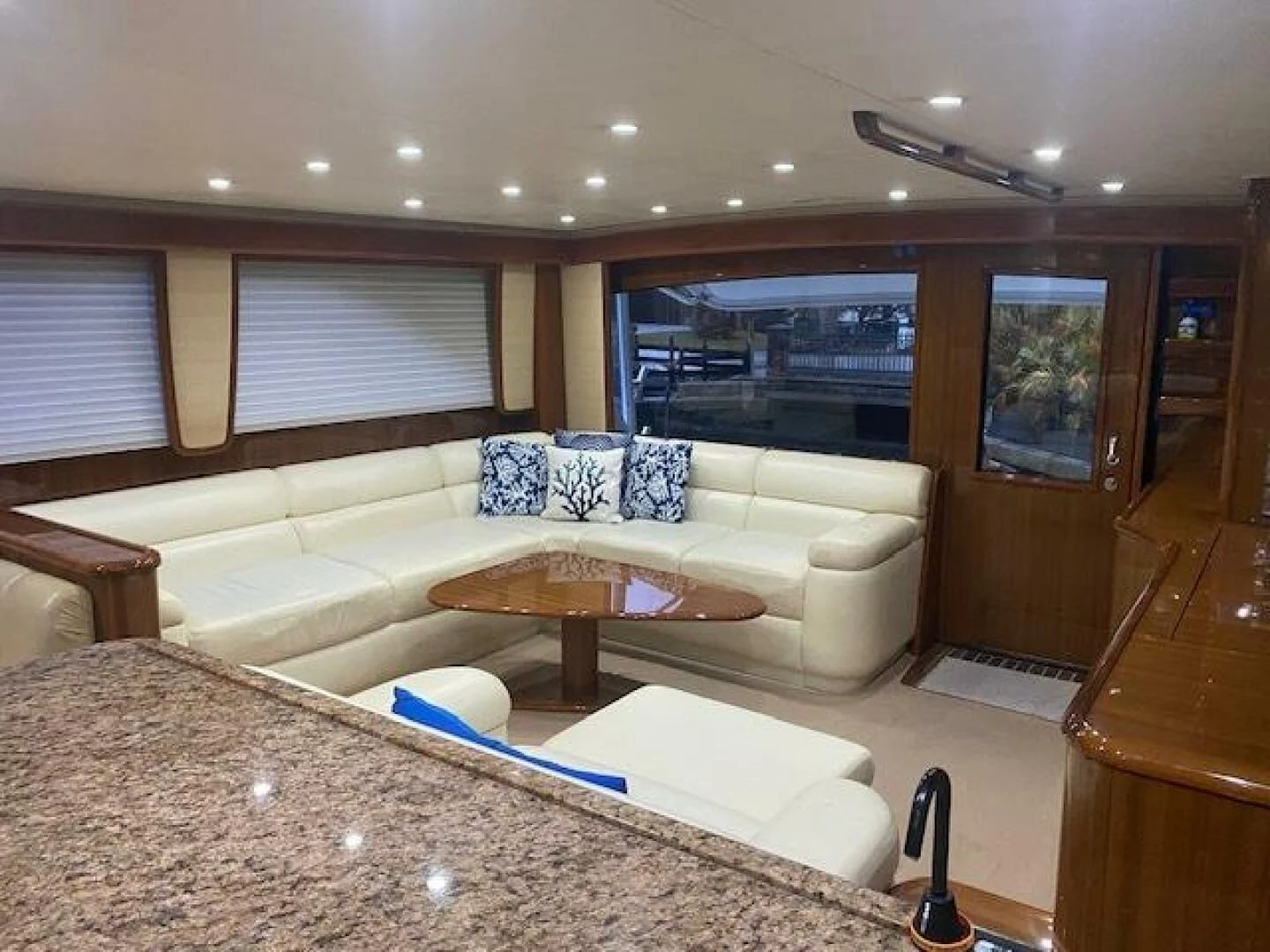 a living room with a large window aboard STABILIZED Yacht for Sale