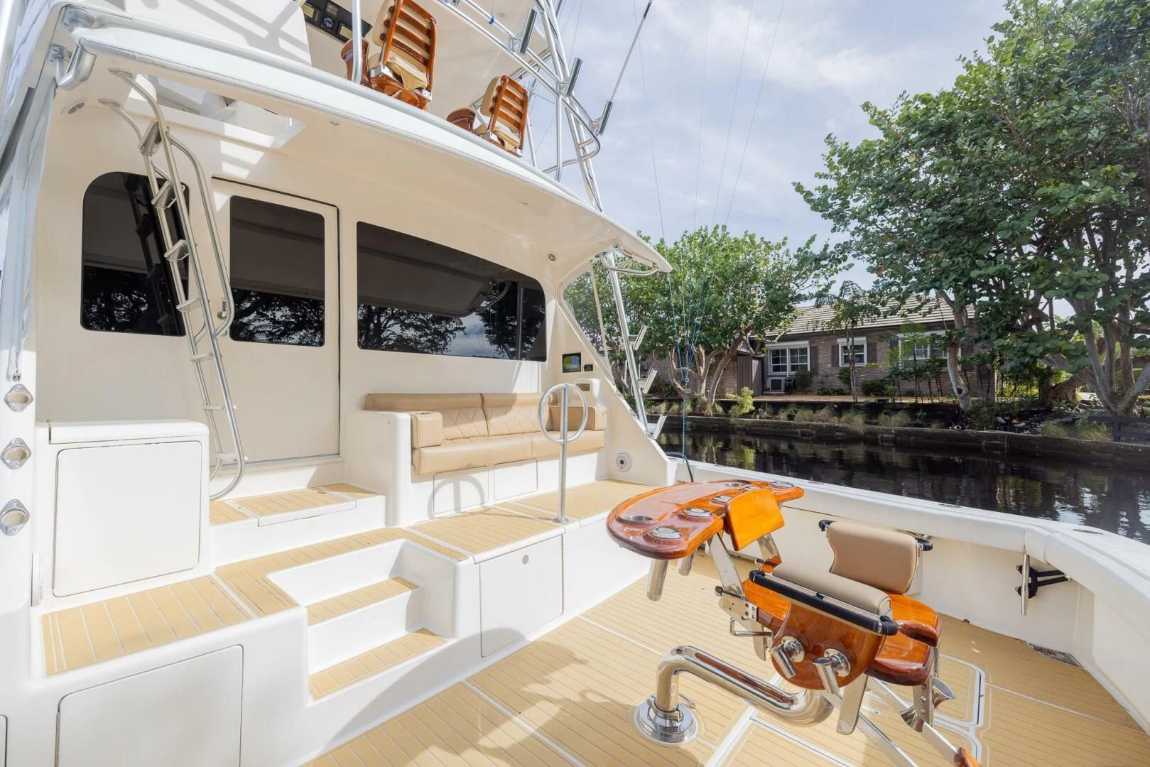 a room with a pool and a deck with chairs and trees aboard STABILIZED Yacht for Sale
