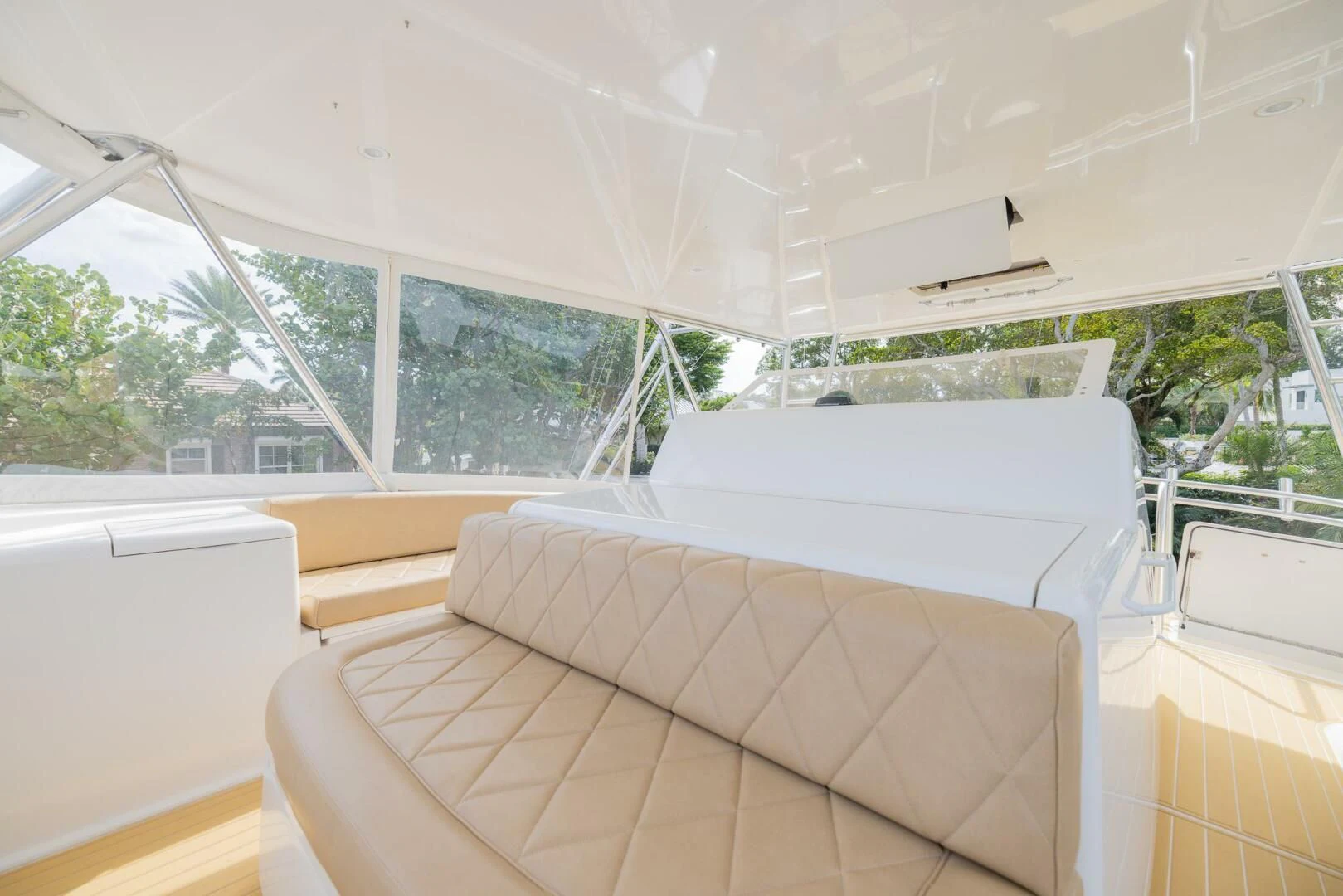 a room with couches and a window aboard STABILIZED Yacht for Sale