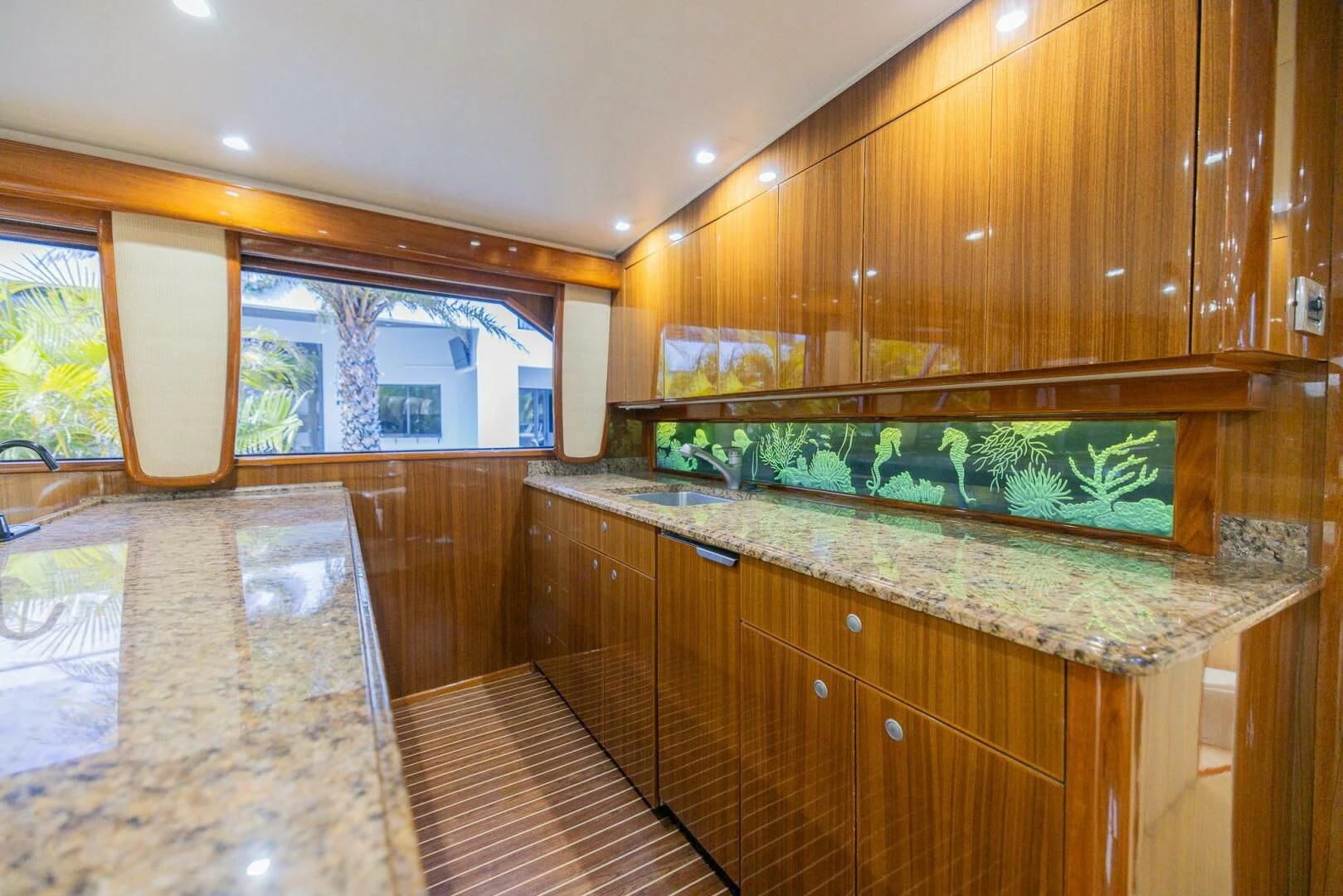 a kitchen with a marble counter top aboard STABILIZED Yacht for Sale