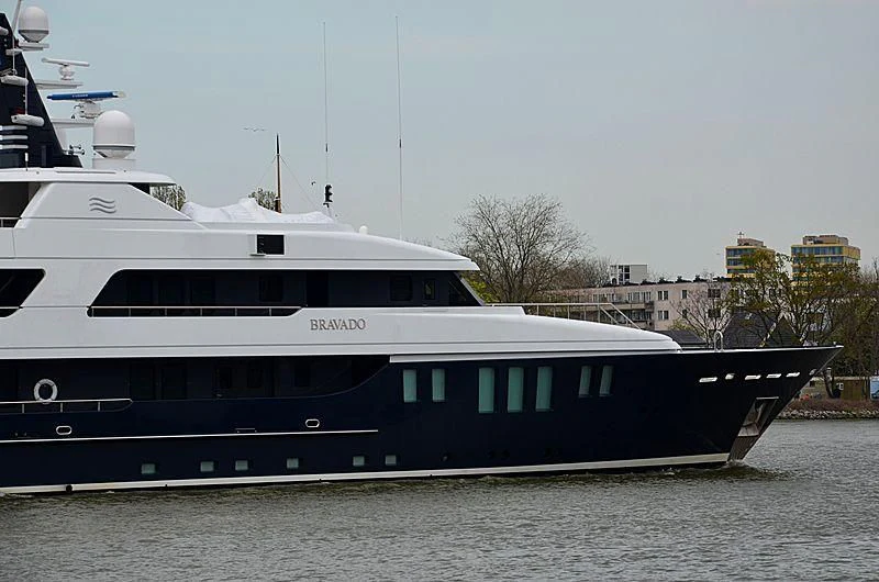 a large white boat in a body of water aboard BRAVADO Yacht for Sale