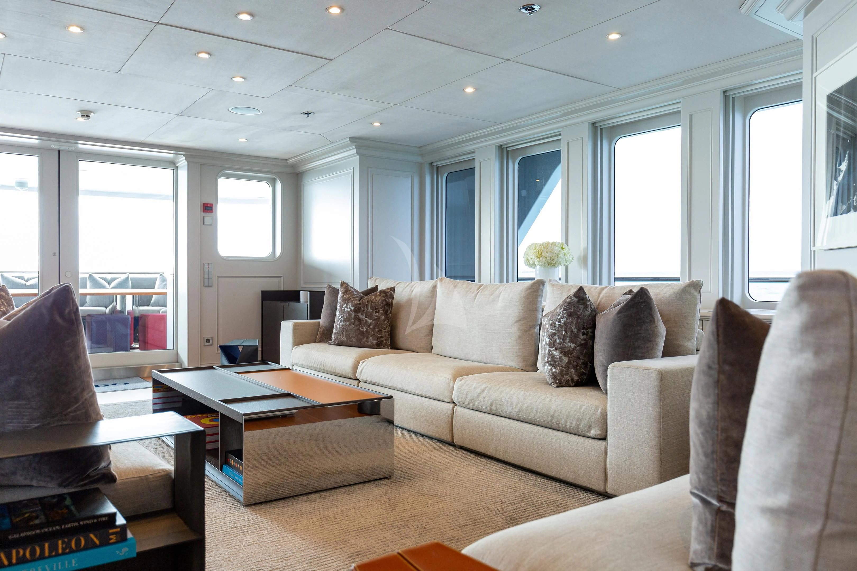 a living room with a couch and a coffee table aboard BRAVADO Yacht for Sale
