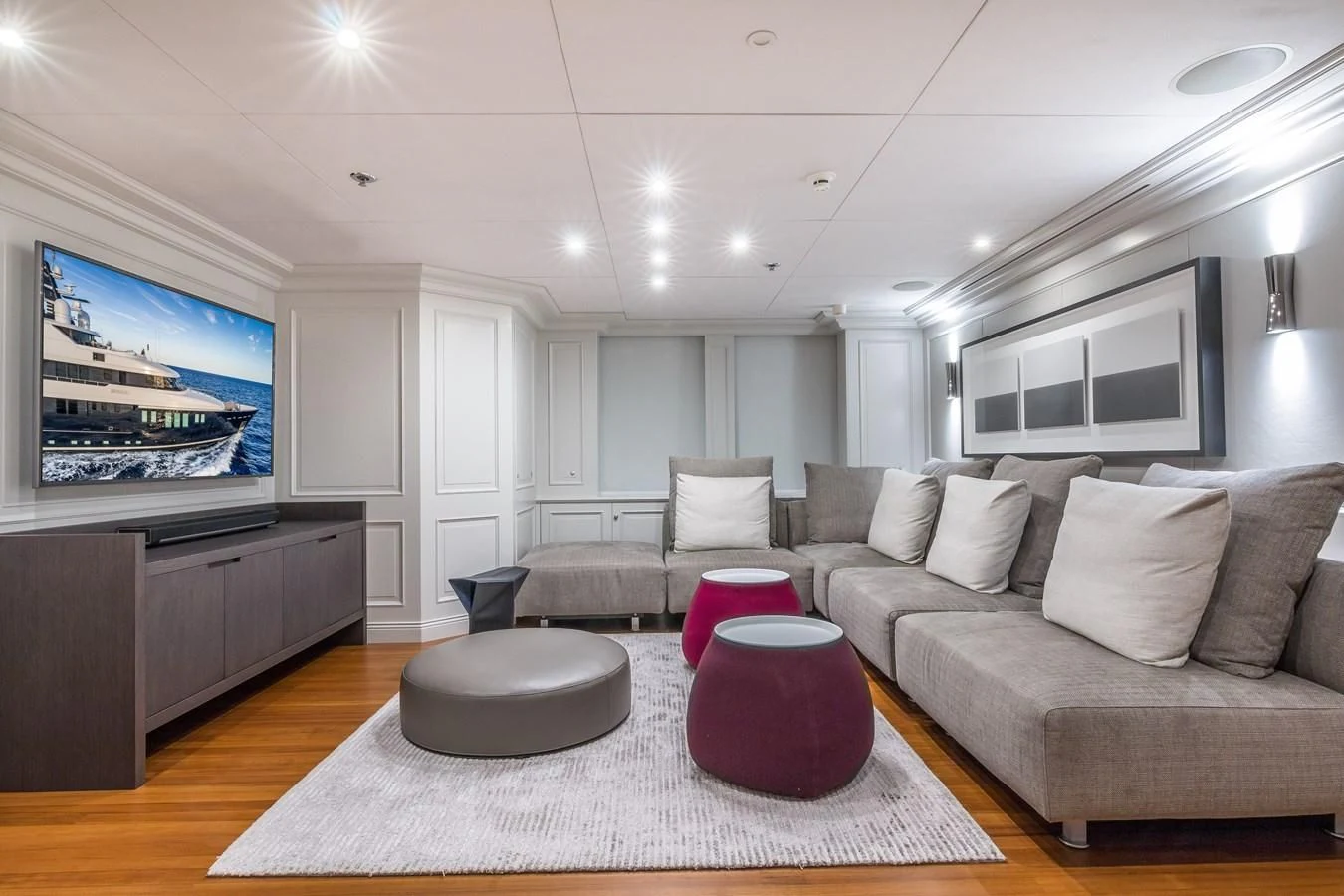a living room with a large screen aboard BRAVADO Yacht for Sale