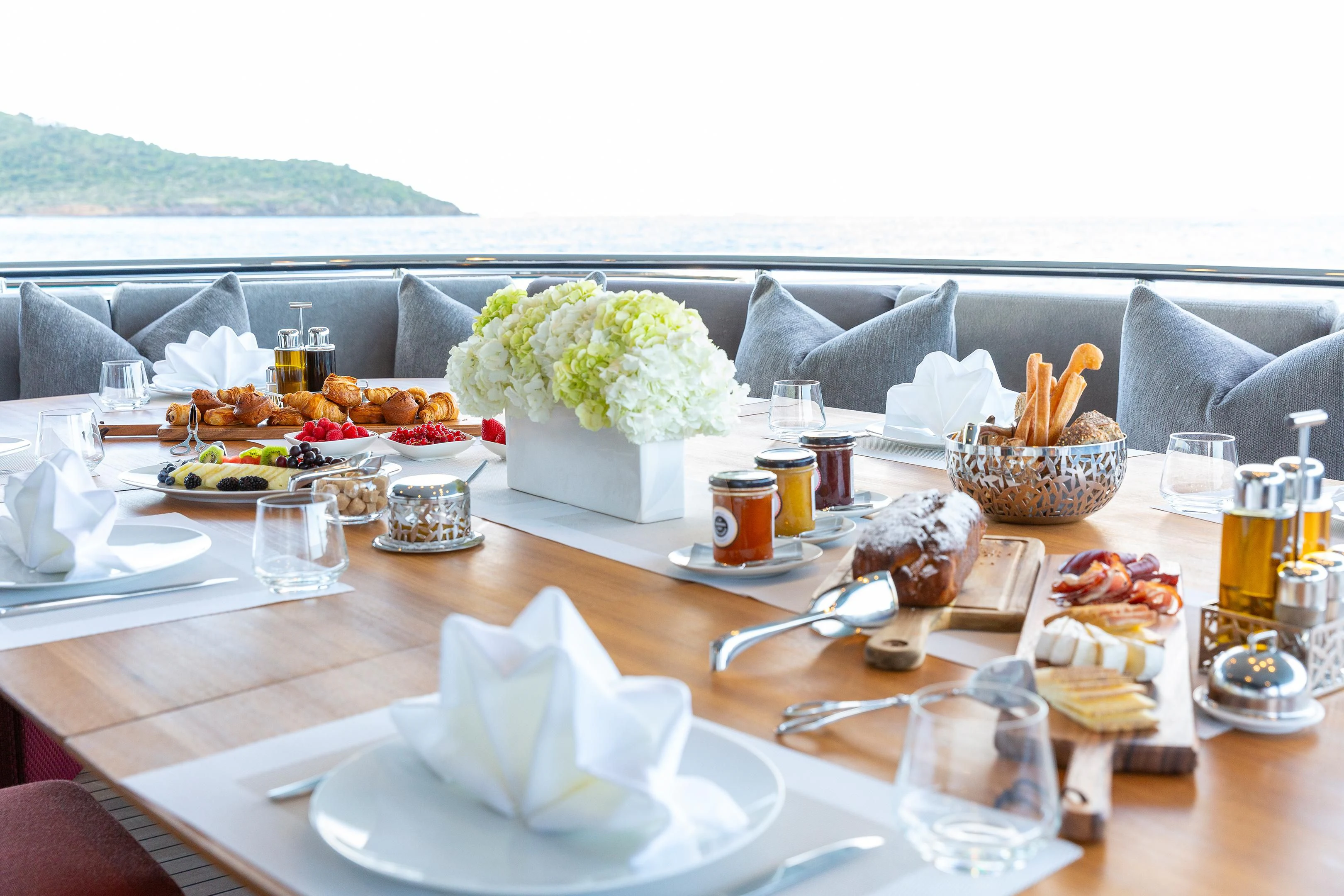 a table with food and drinks on it aboard BRAVADO Yacht for Sale
