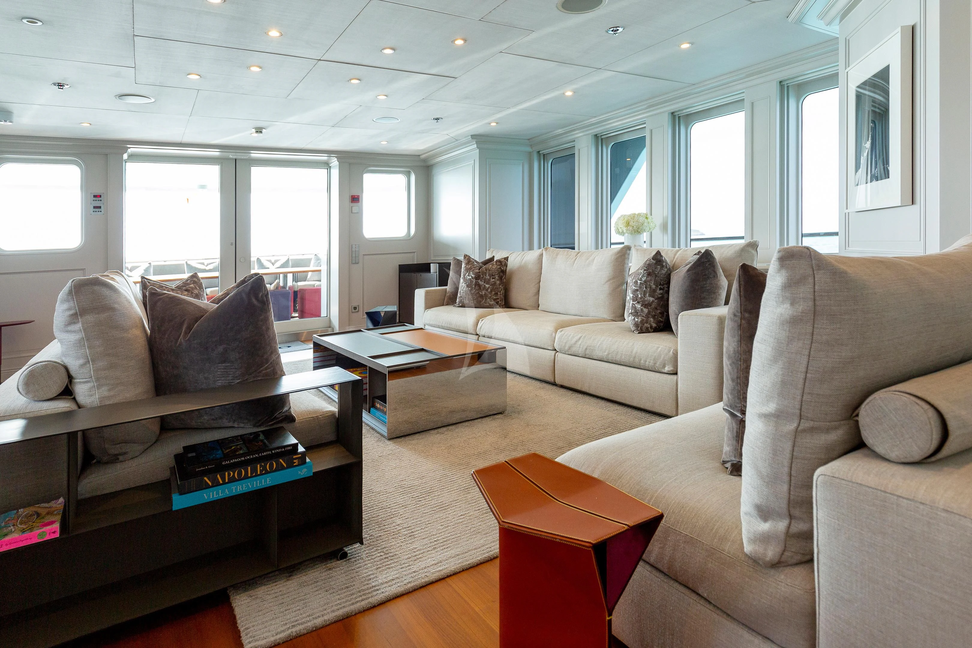 a living room with a couch and a coffee table aboard BRAVADO Yacht for Sale
