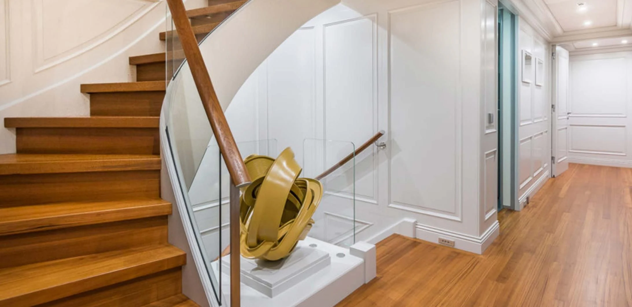a staircase with a metal railing aboard BRAVADO Yacht for Sale