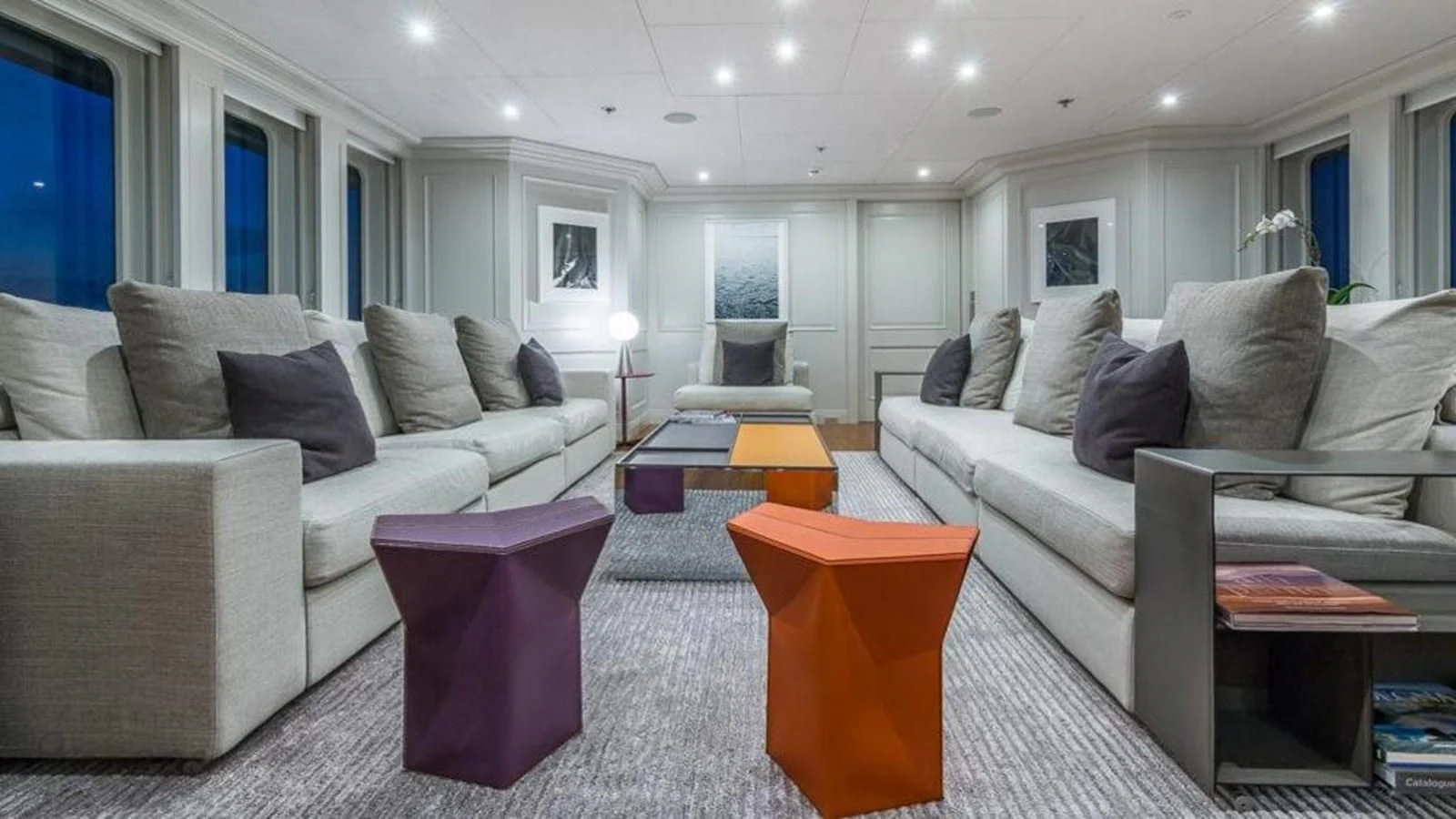 a living room with a white couch and a coffee table aboard BRAVADO Yacht for Sale