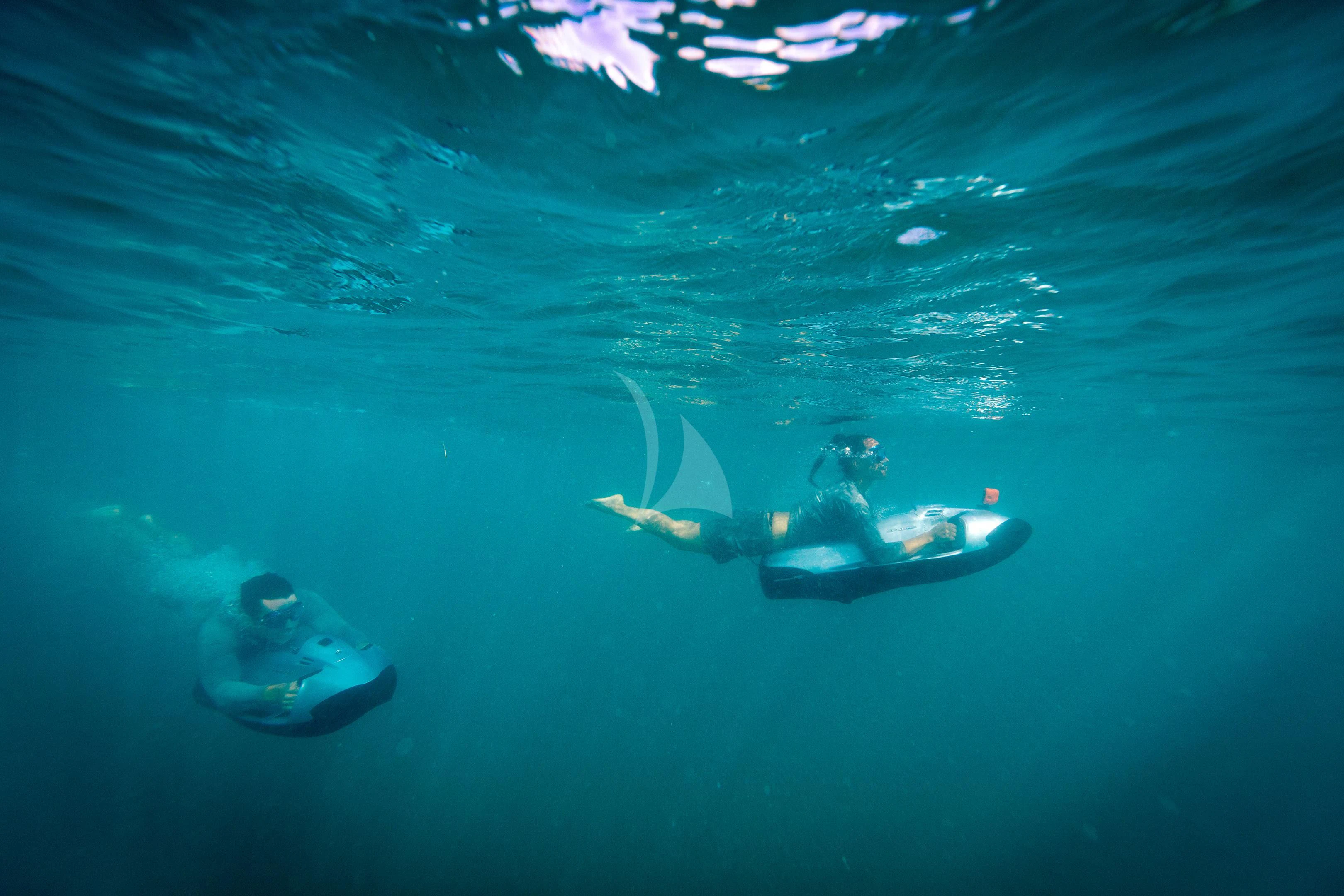 a group of people swimming in the water aboard BRAVADO Yacht for Sale