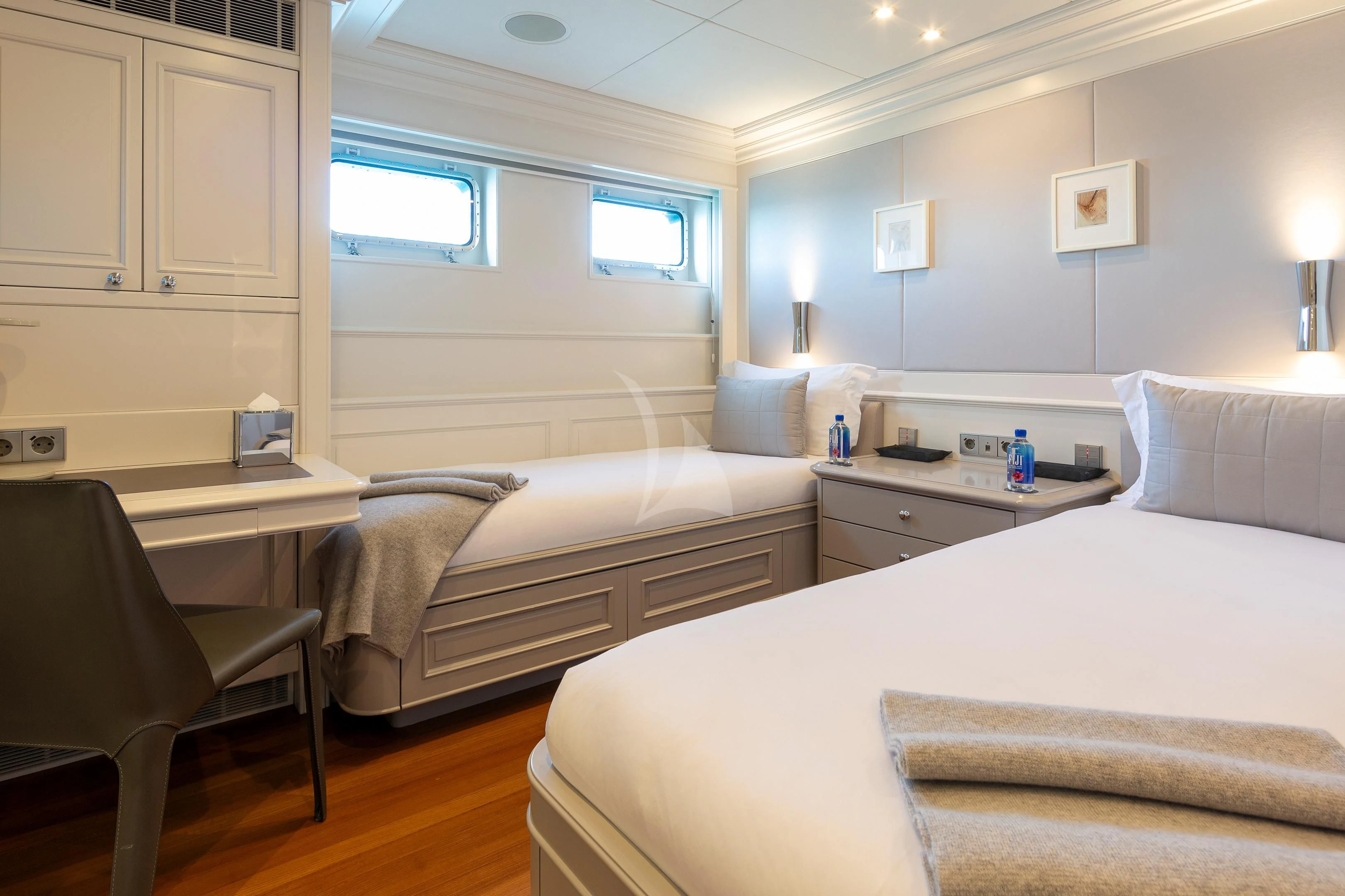 a room with a bed and a desk aboard BRAVADO Yacht for Sale