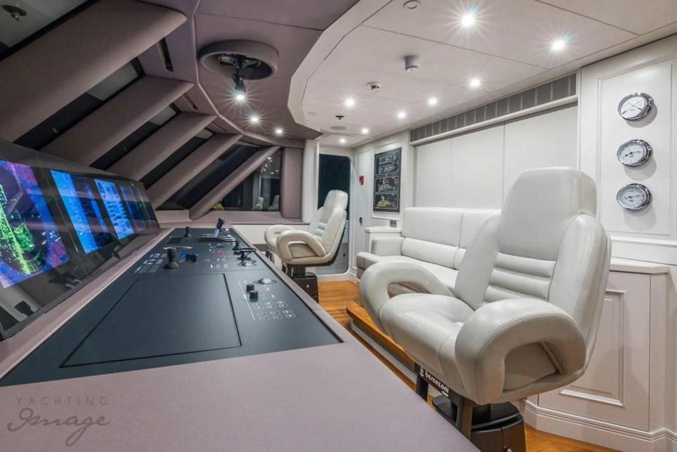 a room with a table chairs and a large window aboard BRAVADO Yacht for Sale