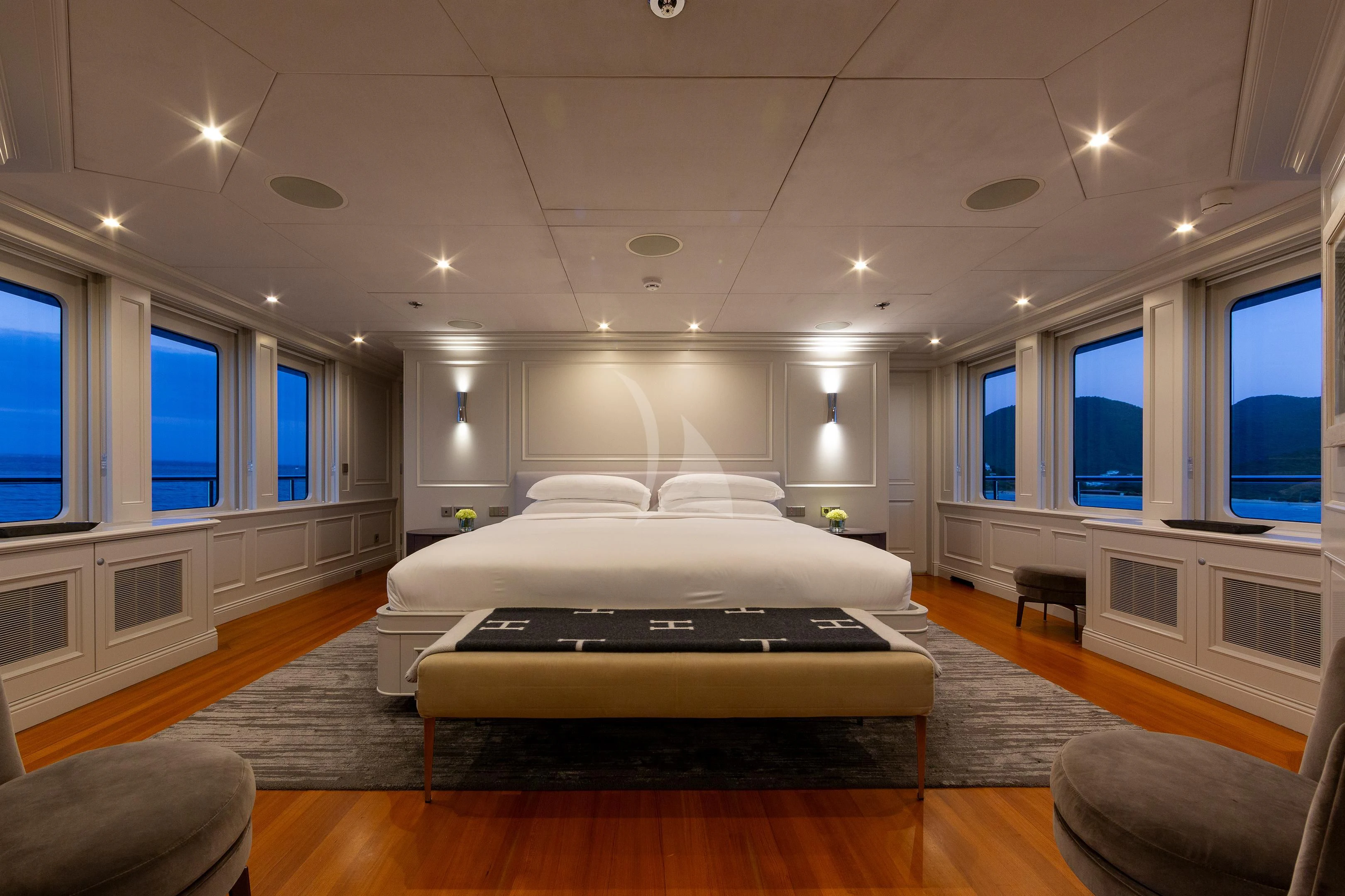a large bedroom with a large bed aboard BRAVADO Yacht for Sale