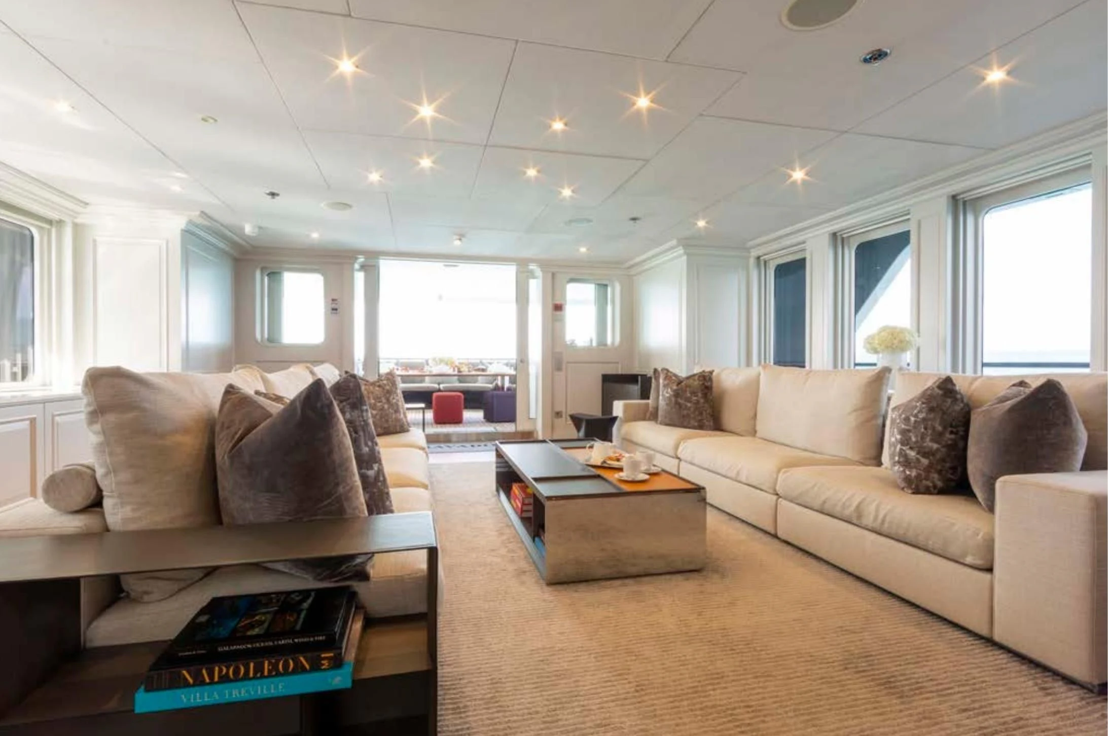a living room with a couch and a coffee table aboard BRAVADO Yacht for Sale
