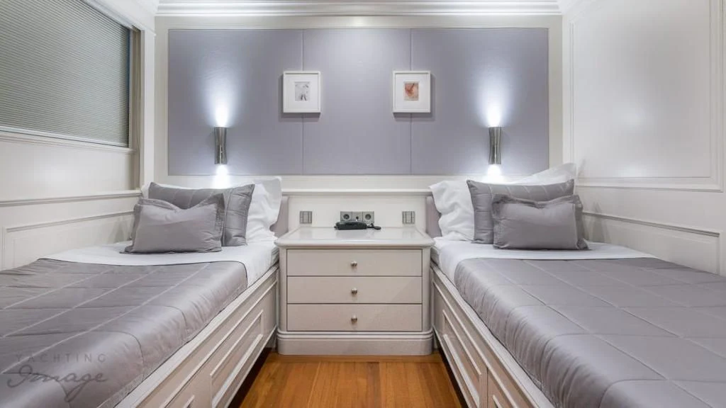 a couple of beds in a hotel room aboard BRAVADO Yacht for Sale