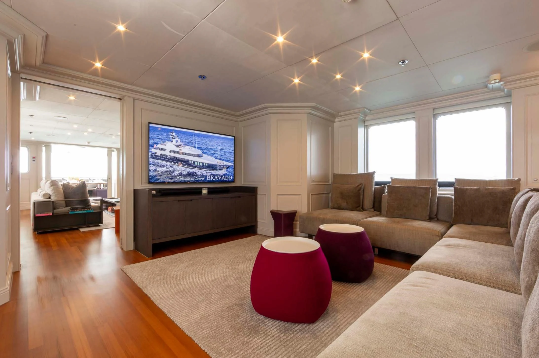 a living room with a couch and a tv aboard BRAVADO Yacht for Sale