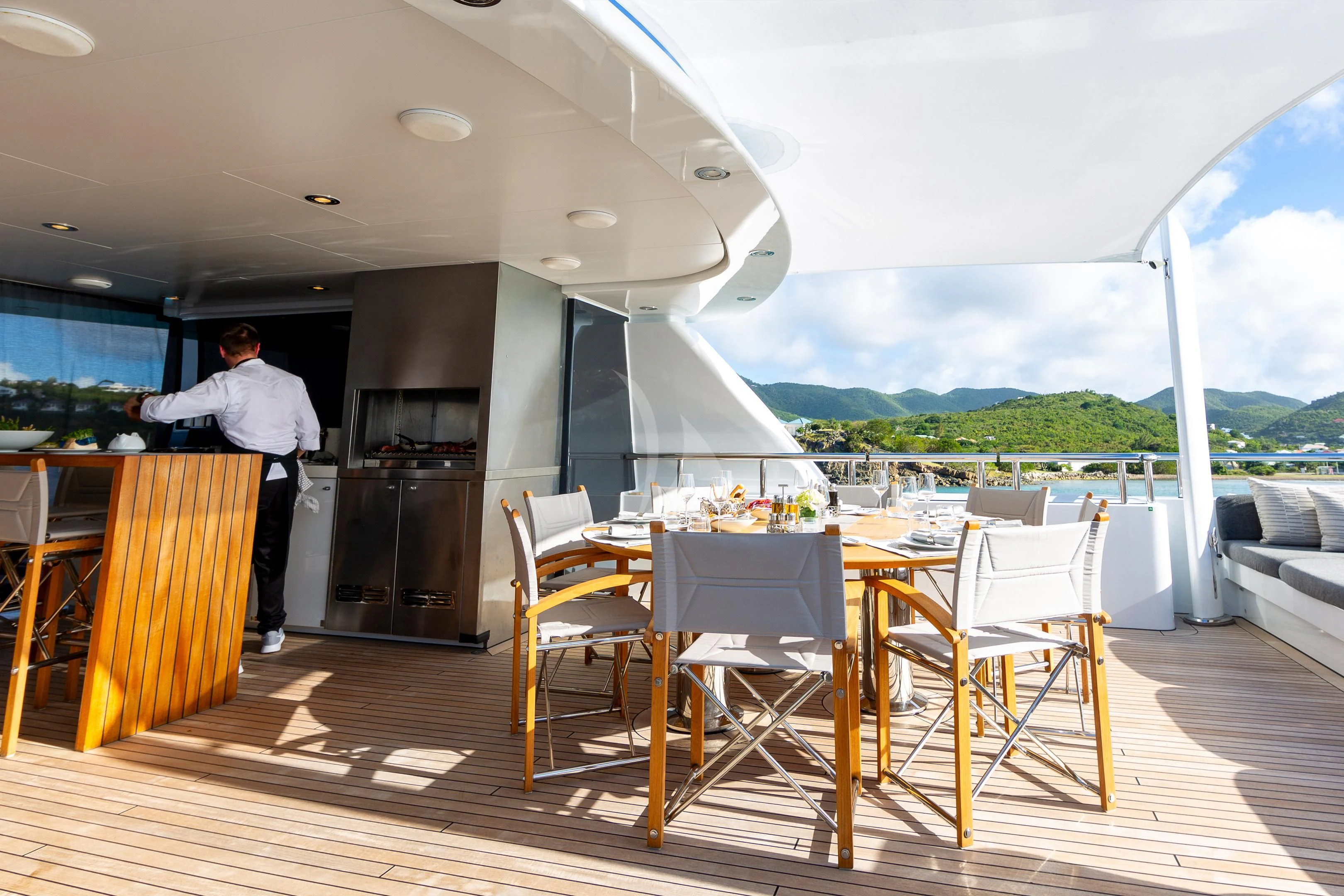 a person standing in a kitchen aboard BRAVADO Yacht for Sale