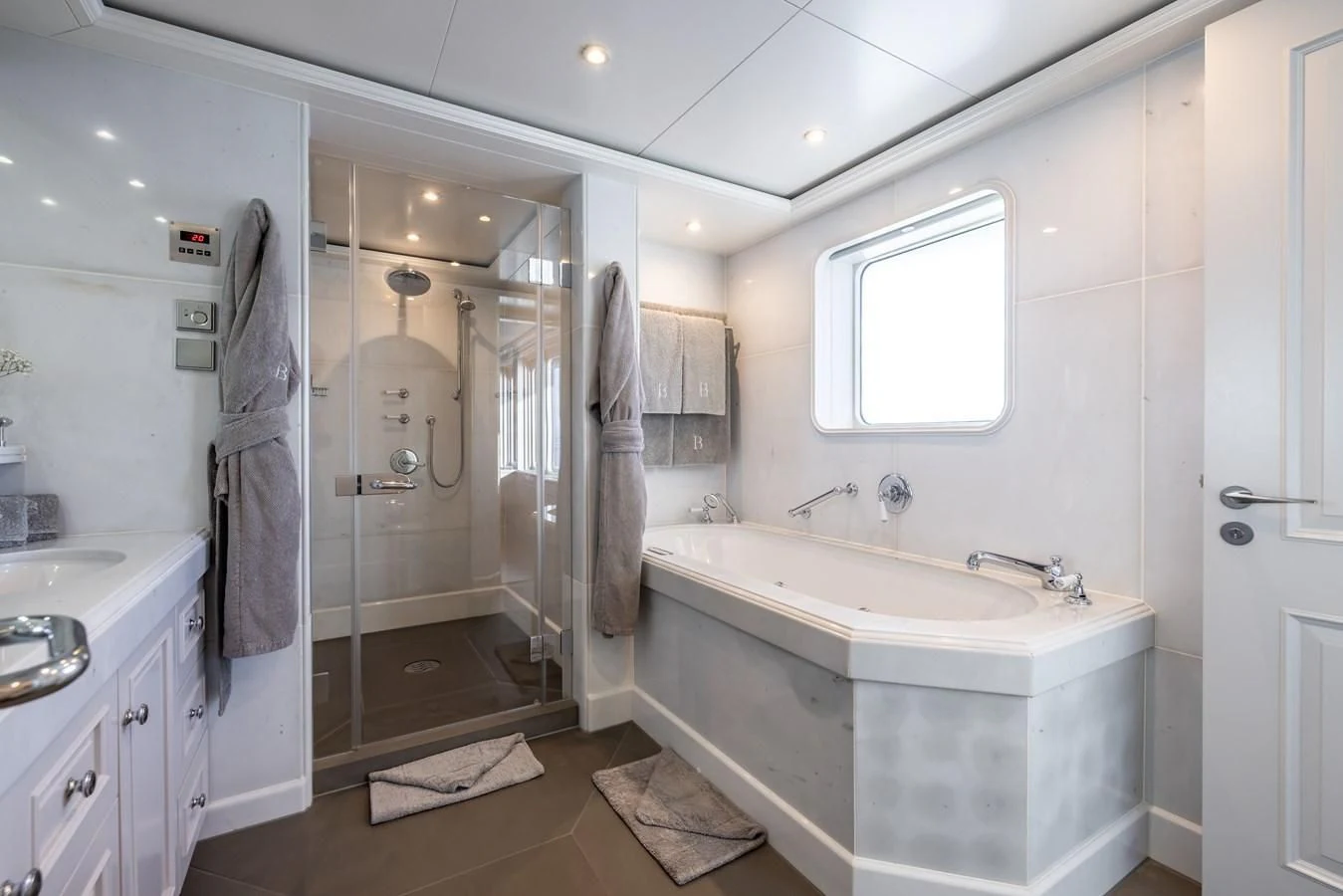 a bathroom with a sink and a mirror aboard BRAVADO Yacht for Sale