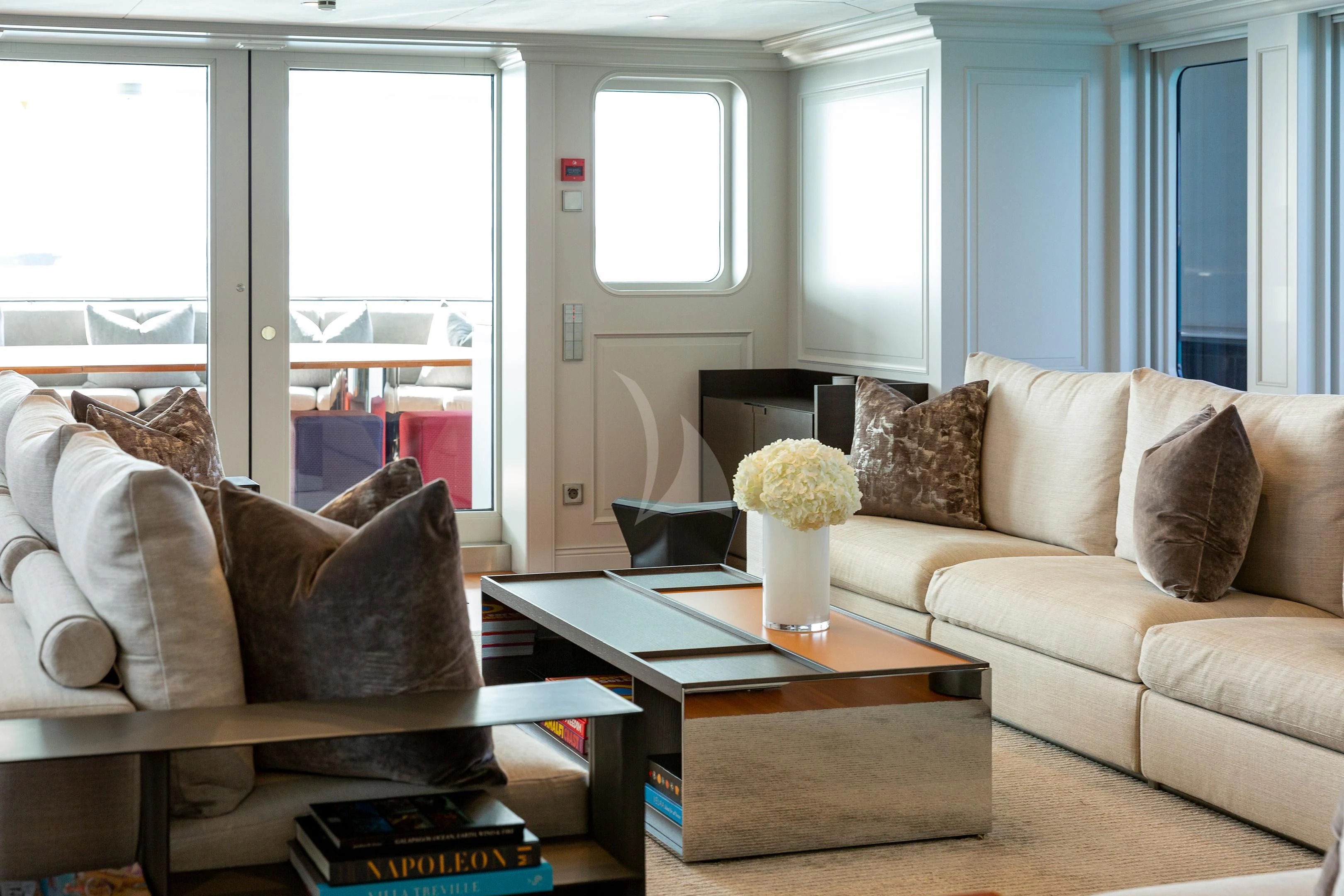 a living room with a couch and coffee table aboard BRAVADO Yacht for Sale