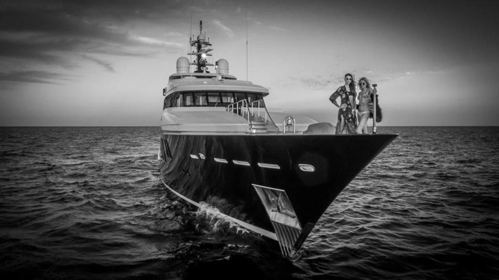a couple of people standing on a boat in the water aboard BRAVADO Yacht for Sale