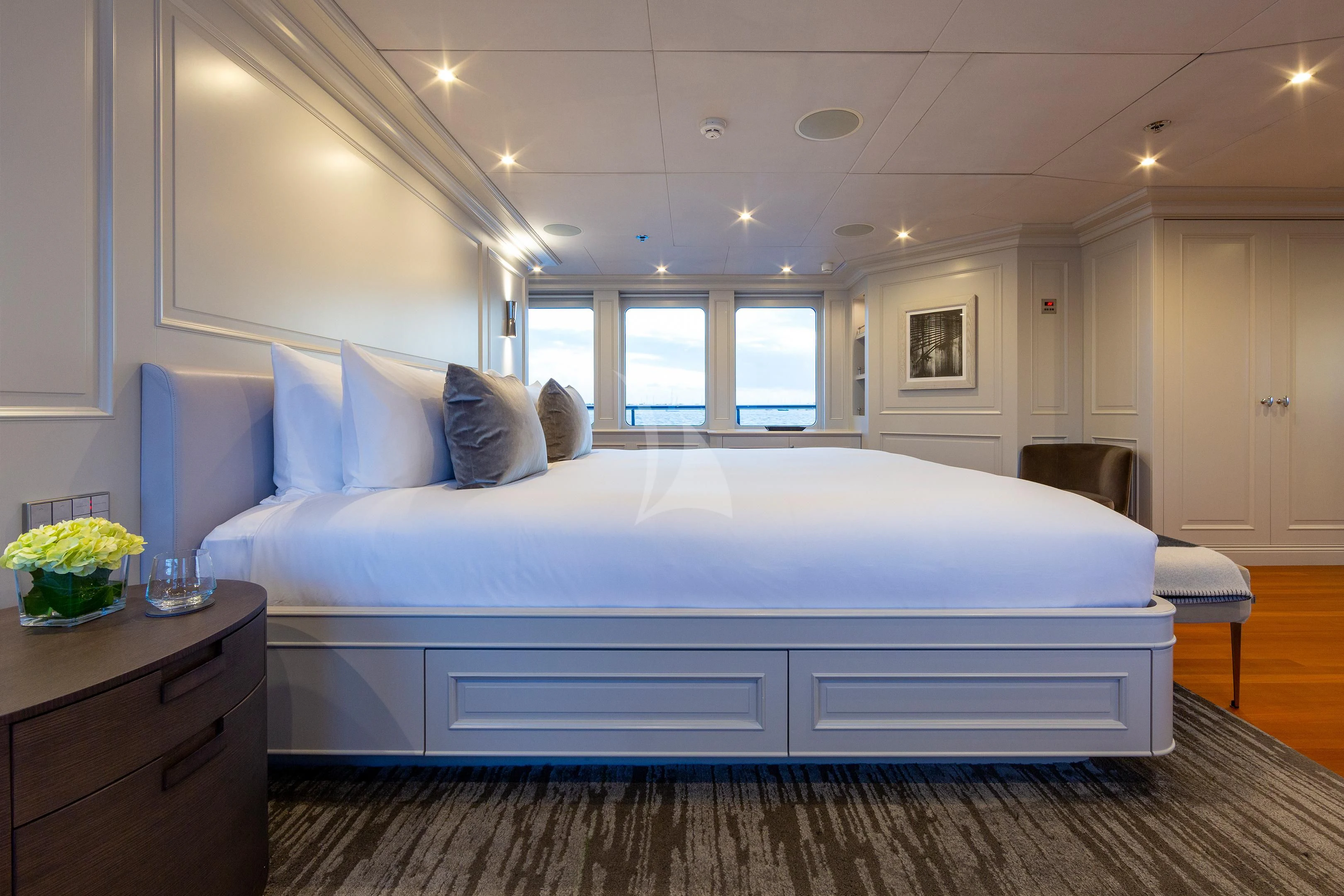 a large white bed in a room aboard BRAVADO Yacht for Sale