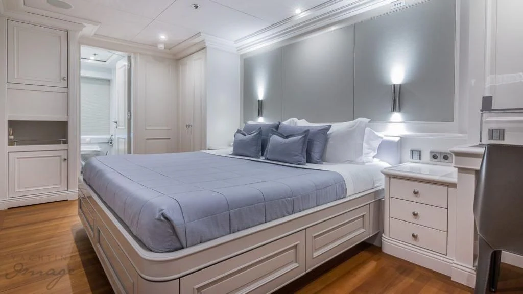 a large bed in a room aboard BRAVADO Yacht for Sale