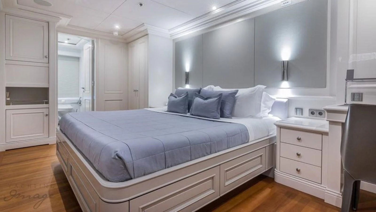 a bed with white sheets aboard BRAVADO Yacht for Sale