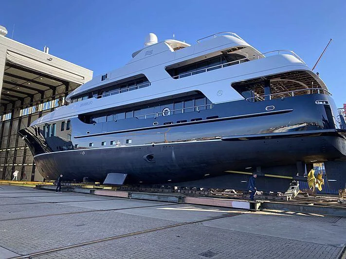 a large boat on a dock aboard BRAVADO Yacht for Sale