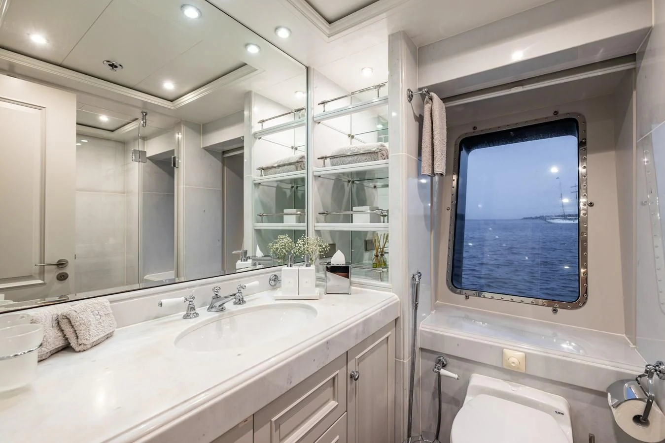 a bathroom with a large mirror aboard BRAVADO Yacht for Sale
