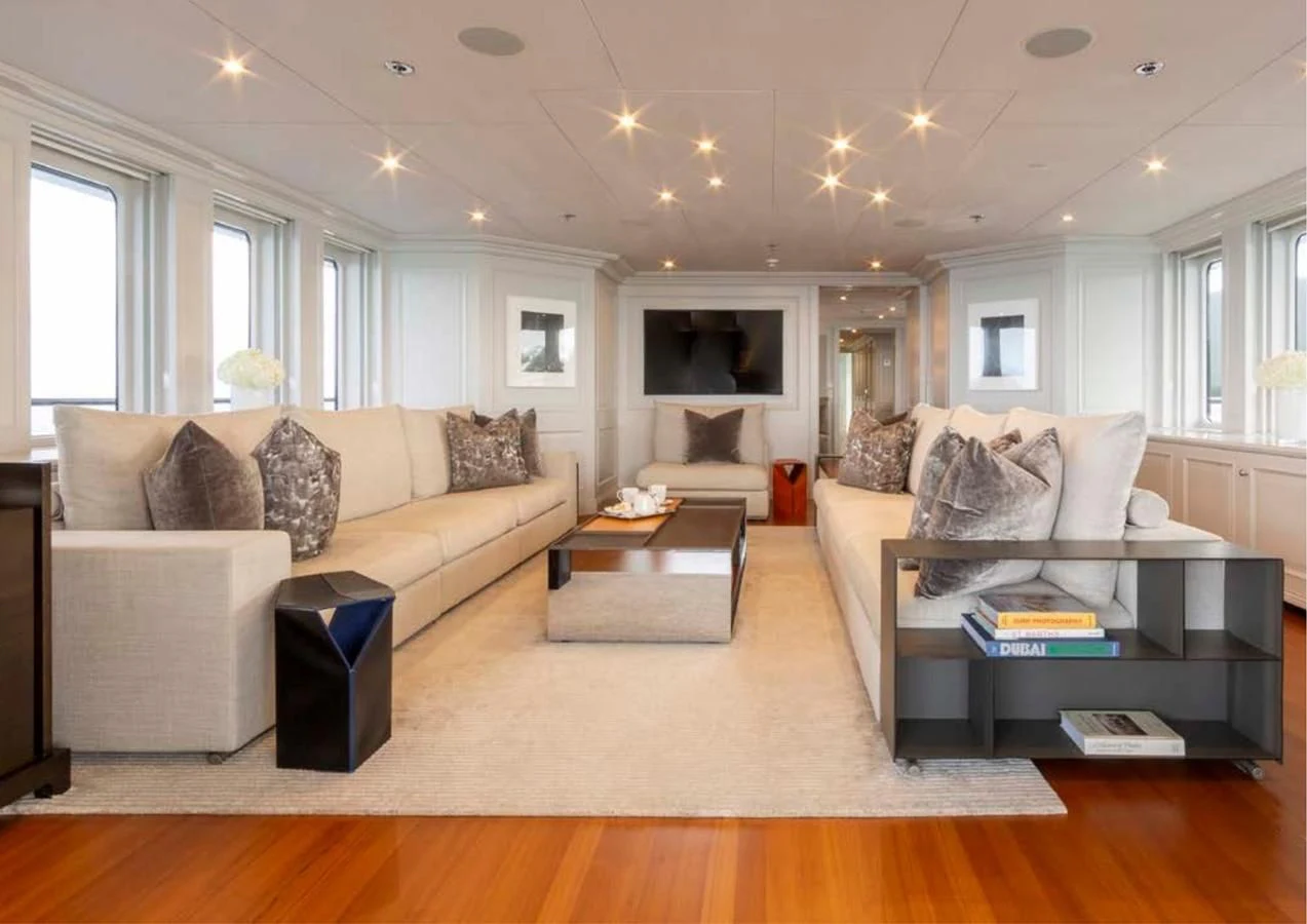 a living room with a couch and a coffee table aboard BRAVADO Yacht for Sale