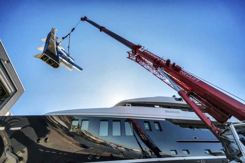 a helicopter flying over a helicopter aboard BRAVADO Yacht for Sale