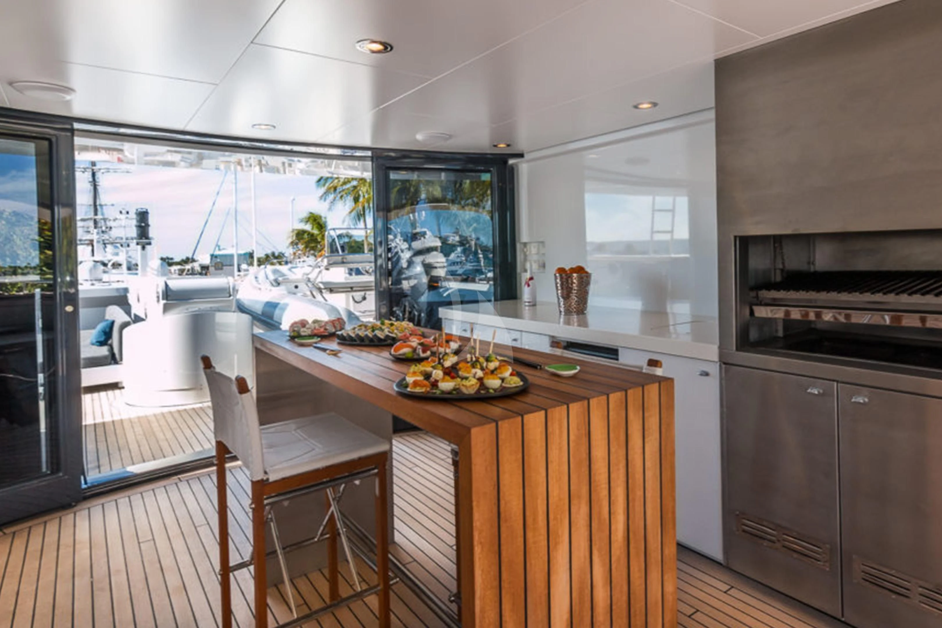 a kitchen with a large window aboard BRAVADO Yacht for Sale