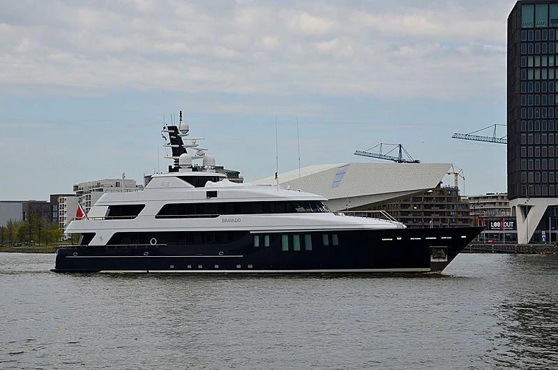 a large boat in a harbor aboard BRAVADO Yacht for Sale