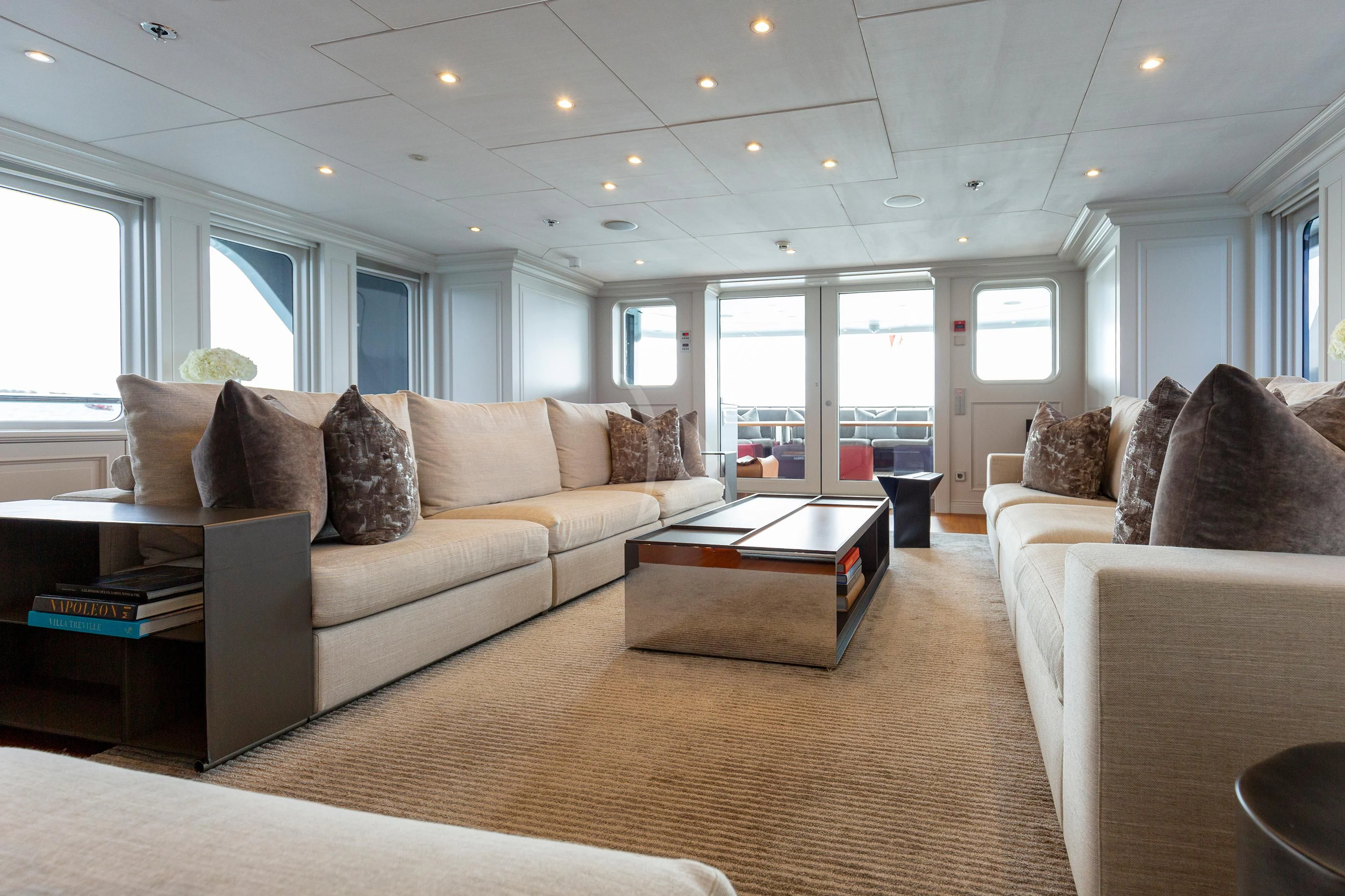 a living room with a couch and a coffee table aboard BRAVADO Yacht for Sale