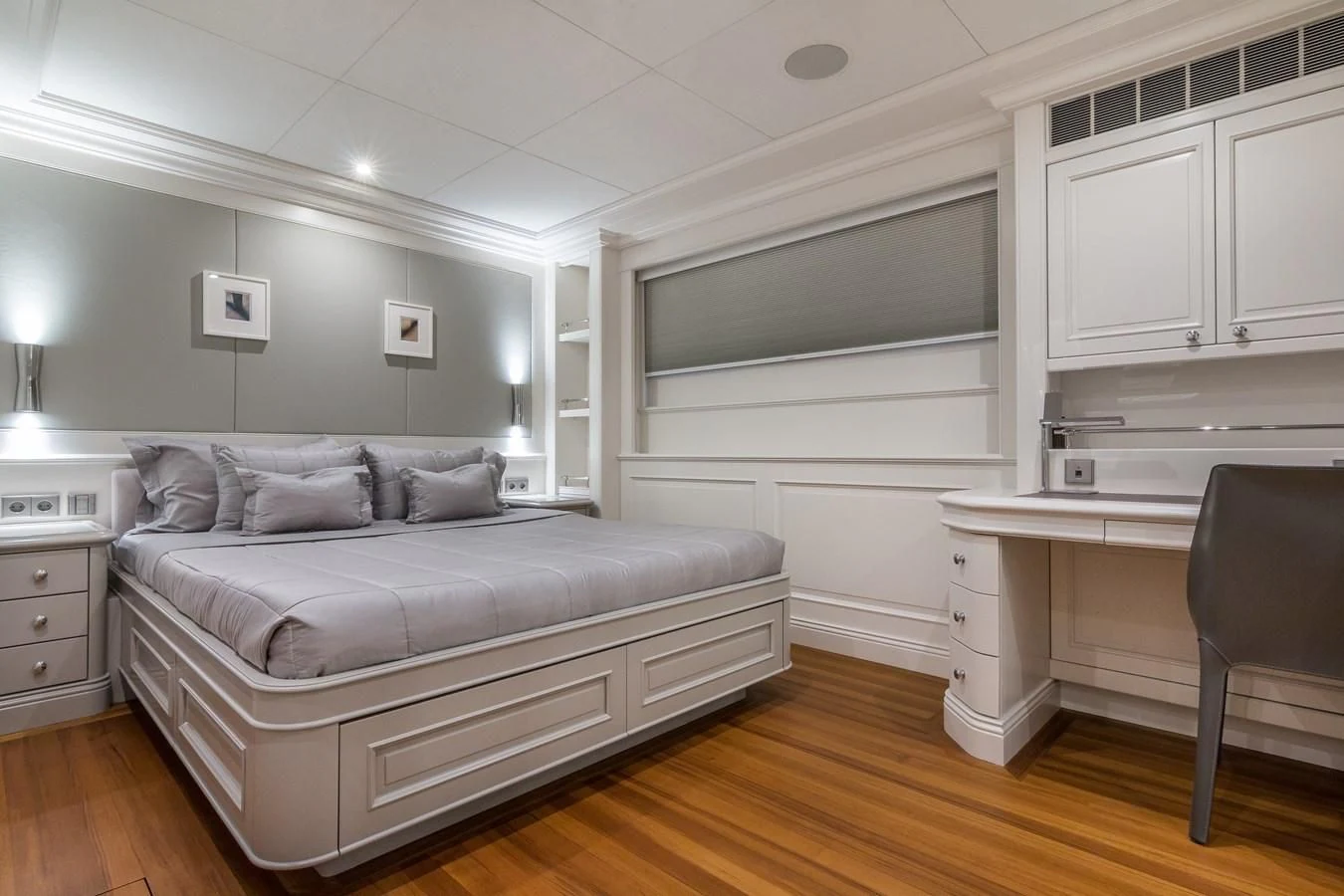 a living room with a couch and a desk aboard BRAVADO Yacht for Sale