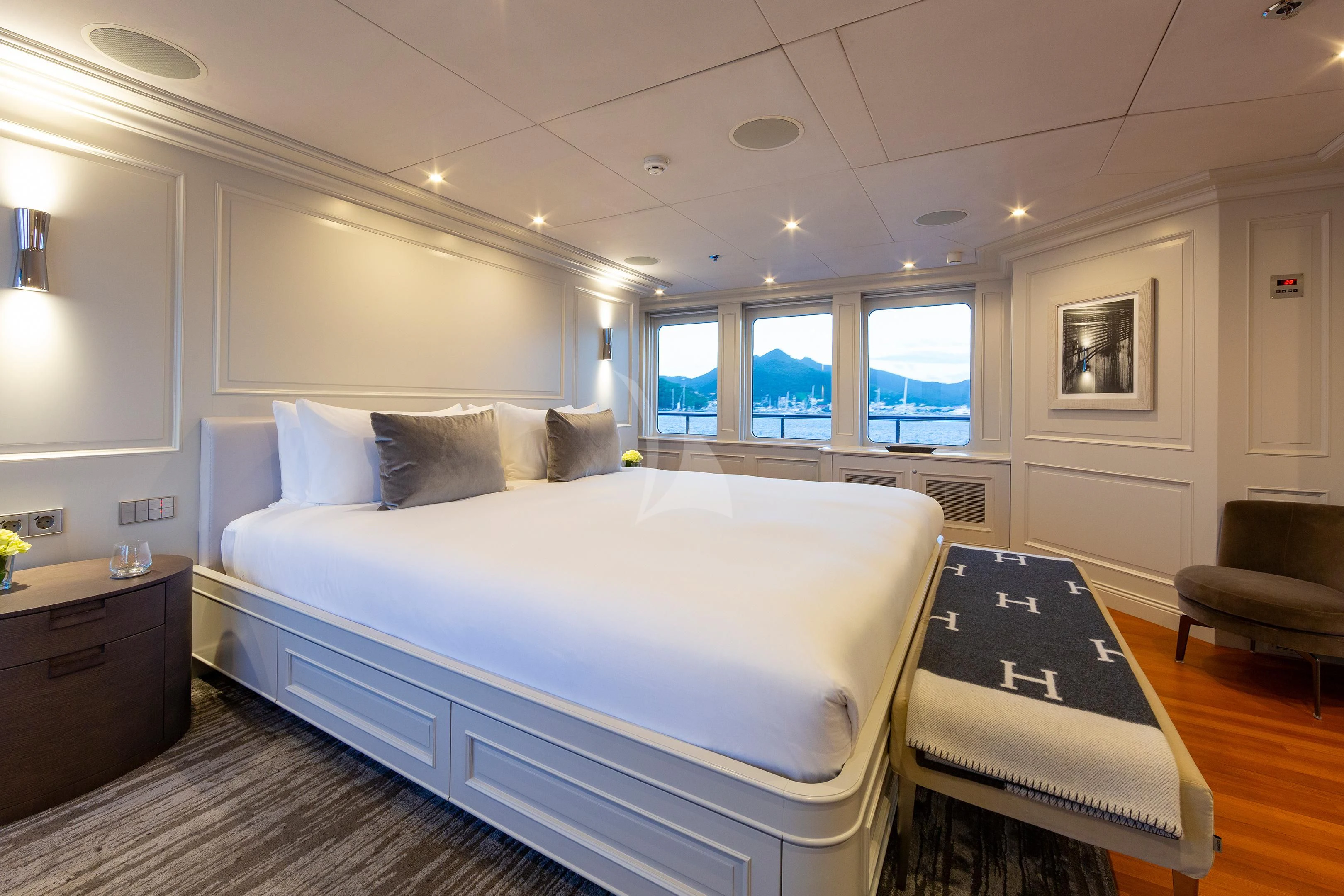 a large bedroom with a bed aboard BRAVADO Yacht for Sale