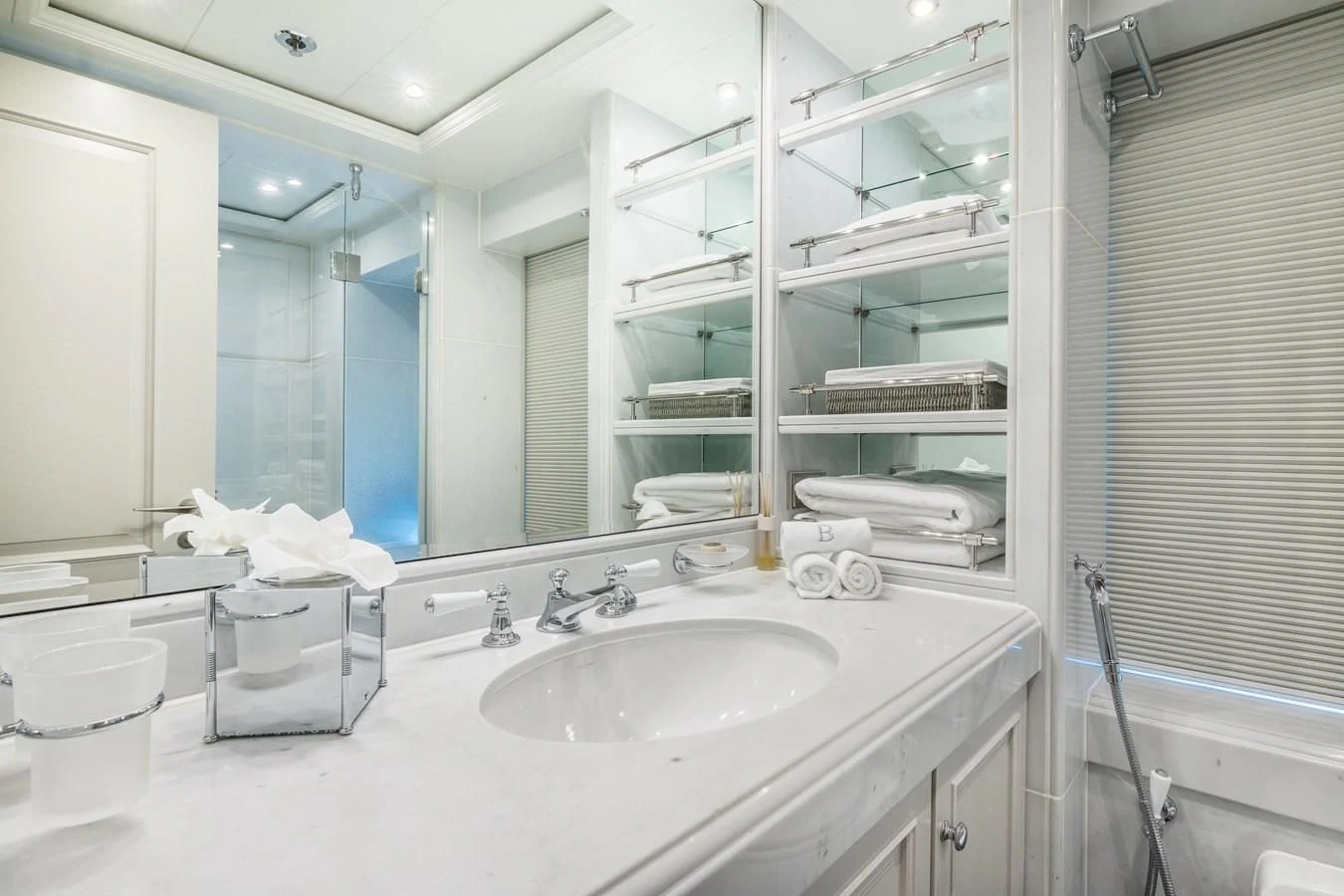 a bathroom with a large mirror aboard BRAVADO Yacht for Sale