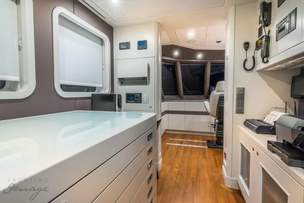 a room with a desk and a computer aboard BRAVADO Yacht for Sale