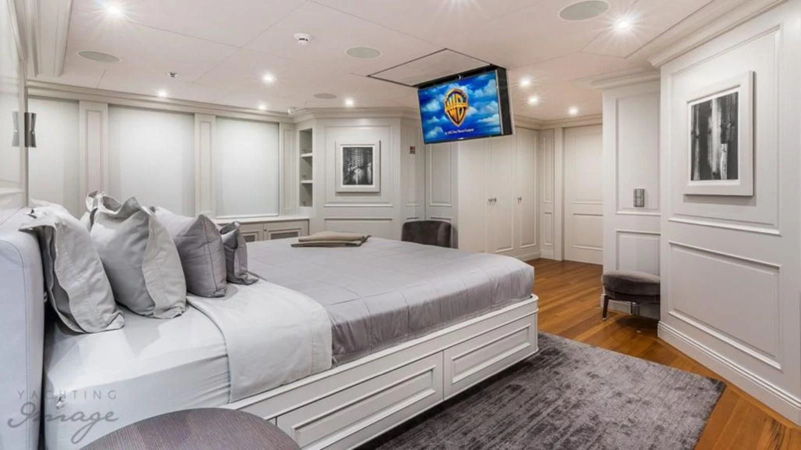a large bedroom with a bed aboard BRAVADO Yacht for Sale