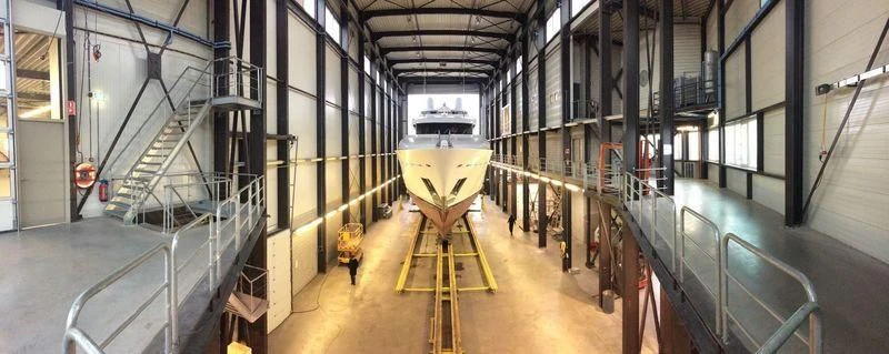 a yellow and black machine in a room with a metal railing aboard BRAVADO Yacht for Sale